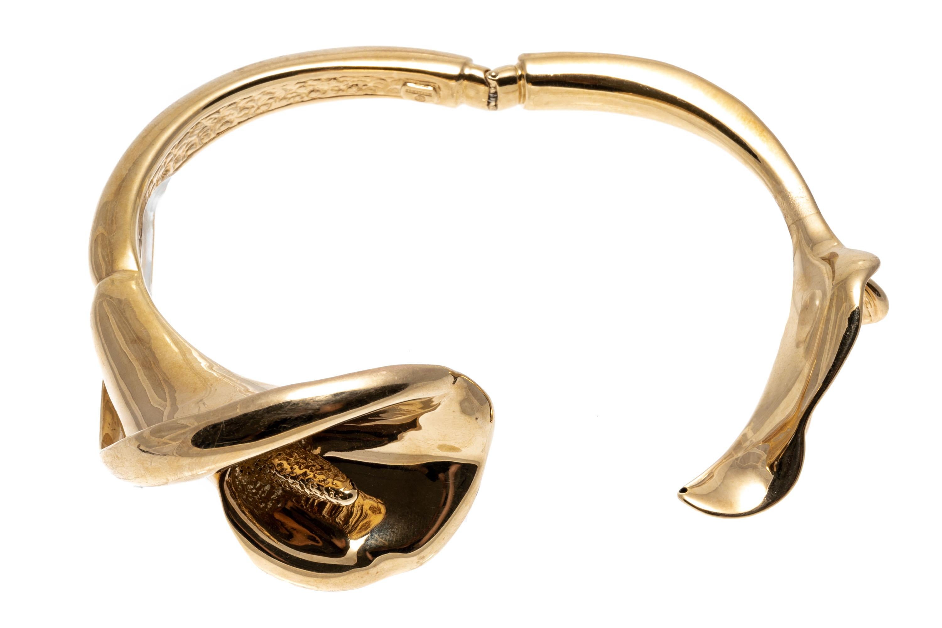 This stunning 14K yellow gold hinged cuff bracelet features a beautiful figural, electro-formed calla lily flower and leaf.
Marks: 14k
Dimensions: 2 1/4