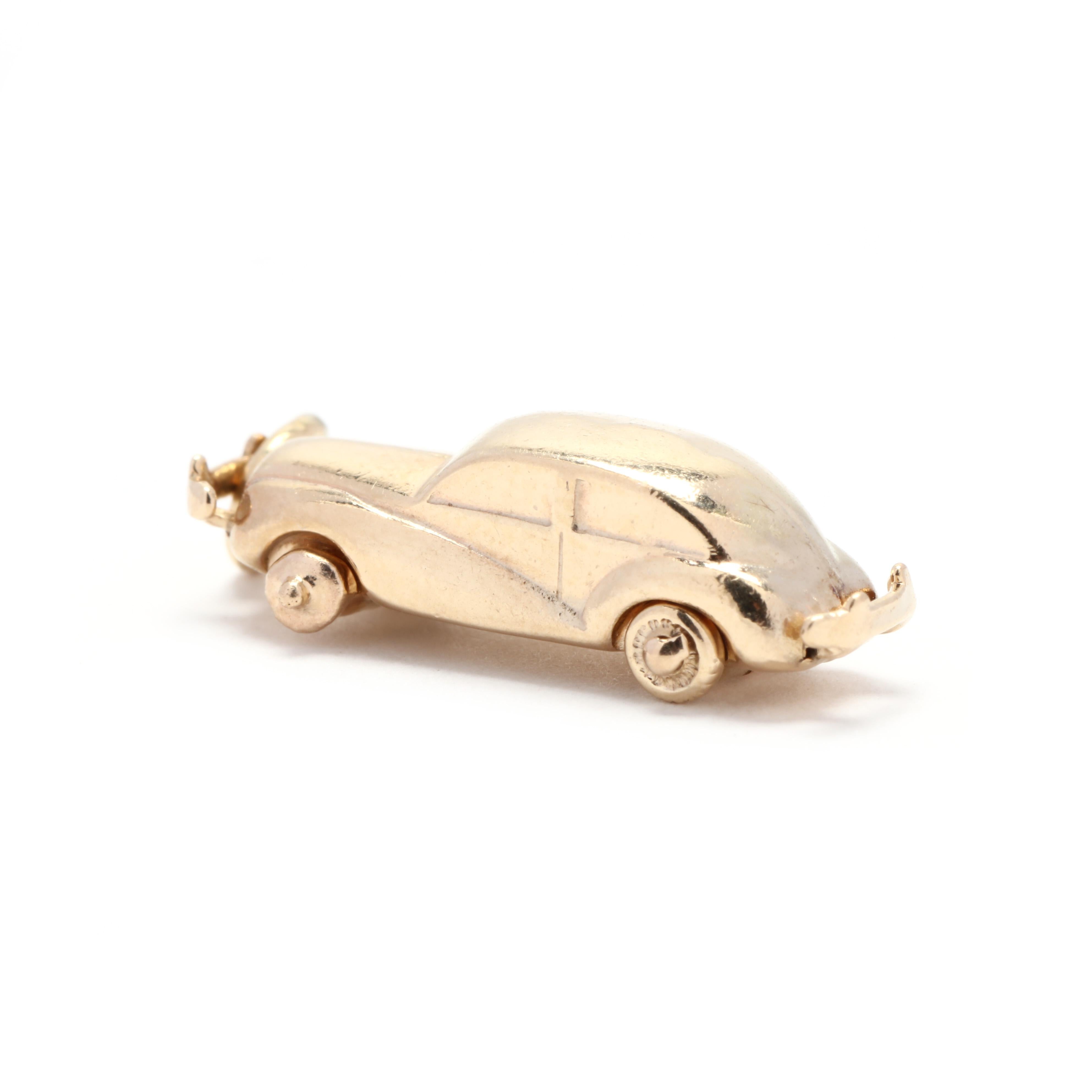 A vintage 14 karat yellow gold car charm. This charm features a vintage car motif with spinning wheels.



Length: 1 in.



Width: 1/4 in.



Weight: 1.5 dwts.