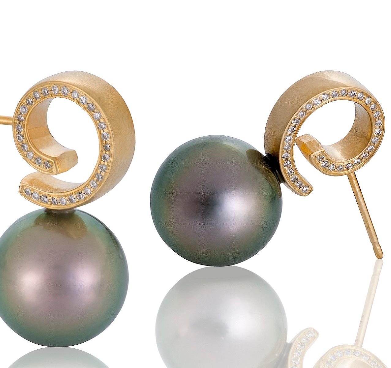 For the pearl lover out there - this pair of Cirrus Tahitian pearl earrings will make you swoon. The pearls are over 11mm each and have the iridescent beautiful shades of green, pink and gold that the most sought after Tahitian pearls are known for.