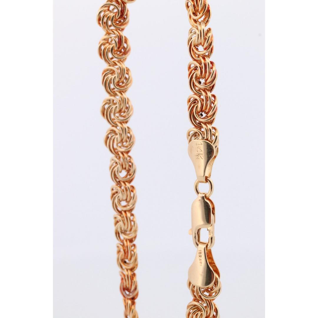 Bracelet 14k Coil Weave. Bracelet de chaîne à maillons ronds en or jaune avec nœud d'amour. Bon état - En vente à Port Charlotte, FL
