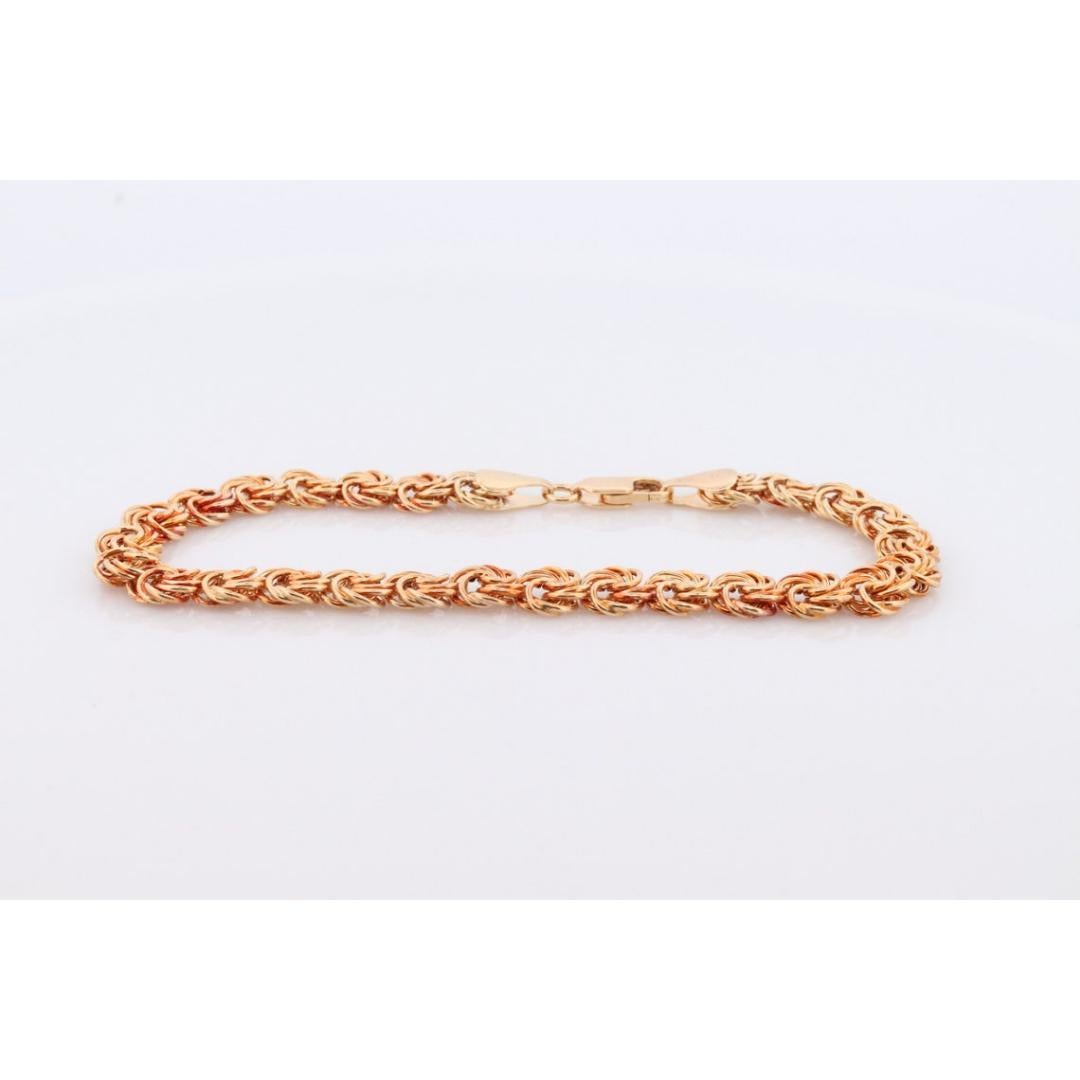 Bracelet 14k Coil Weave. Bracelet de chaîne à maillons ronds en or jaune avec nœud d'amour. en vente 1