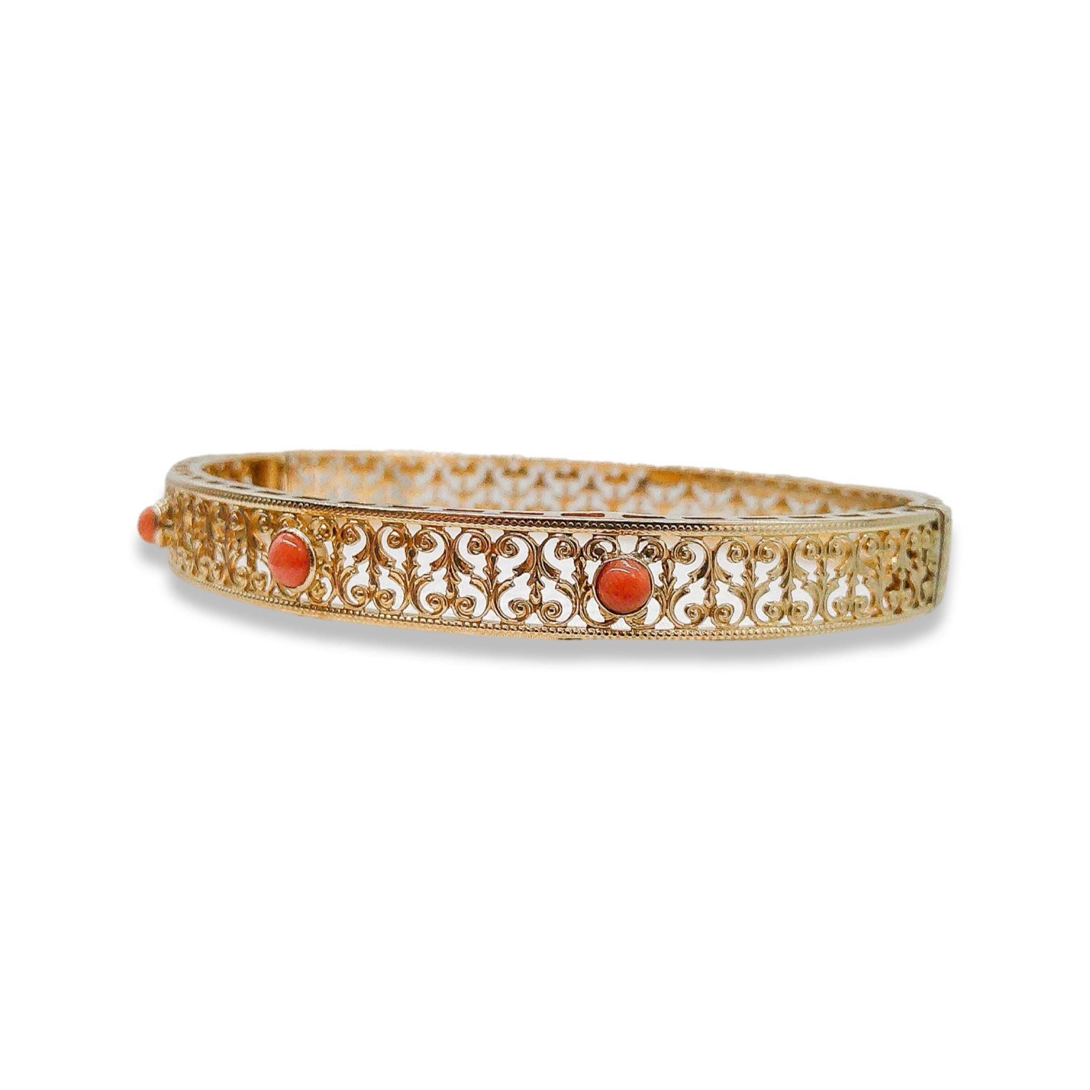This 14k gold coral bangle is a contemporary piece. Three stunning coral stones take center stage, each delicately cradled in the warm embrace of 14k gold. Their gentle hues bring to mind the soft caress of the sea breeze and the sun's gentle kiss.
