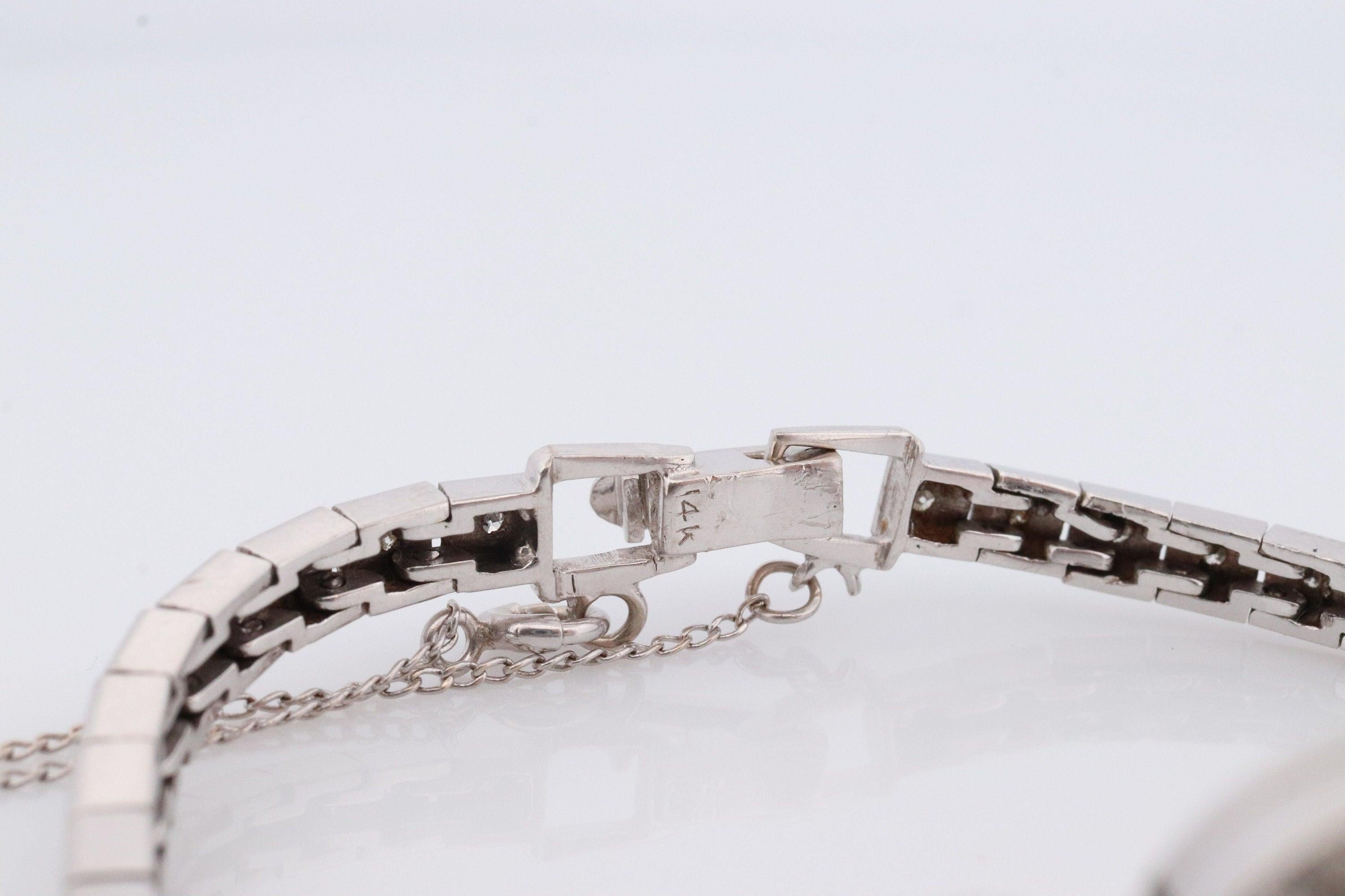 Stunning CROTON Nivada Grenchen watch. Case and band is 14k White Gold. Diamonds everywhere!!
1.25mm diamonds (67) 0.67ctw total weight
Condition: Watch works. Winds and ticks beautifully. Will need daily winding. 
Details:

6.25in wrist

15mm by