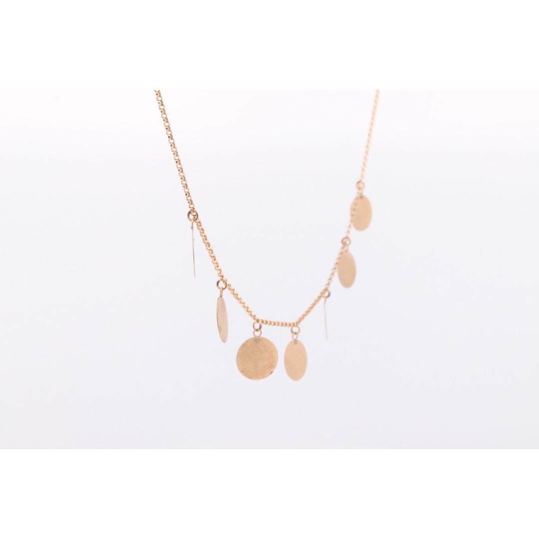 Vintage des années 1990

MATERIAL : Or

Collier très unique. En or jaune 14k, des charmes en forme de disques ronds pendent de la chaîne.

Détails
Longueur de 18 pouces
3,2 grammes de poids total
Disques ronds de 10 mm.

Les boucles d'oreilles et la