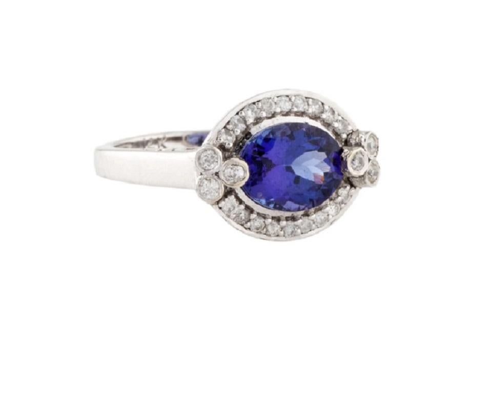 This is an exquisite diamond and tanzanite ring stamped in 14K White Gold. Featuring round brilliant diamonds along with a tanzanite.

*****
Details:
►Metal: White Gold
►Gold Purity: 14K
►Diamond Shape: Round Brilliant
► Diamond Weight: 0.32