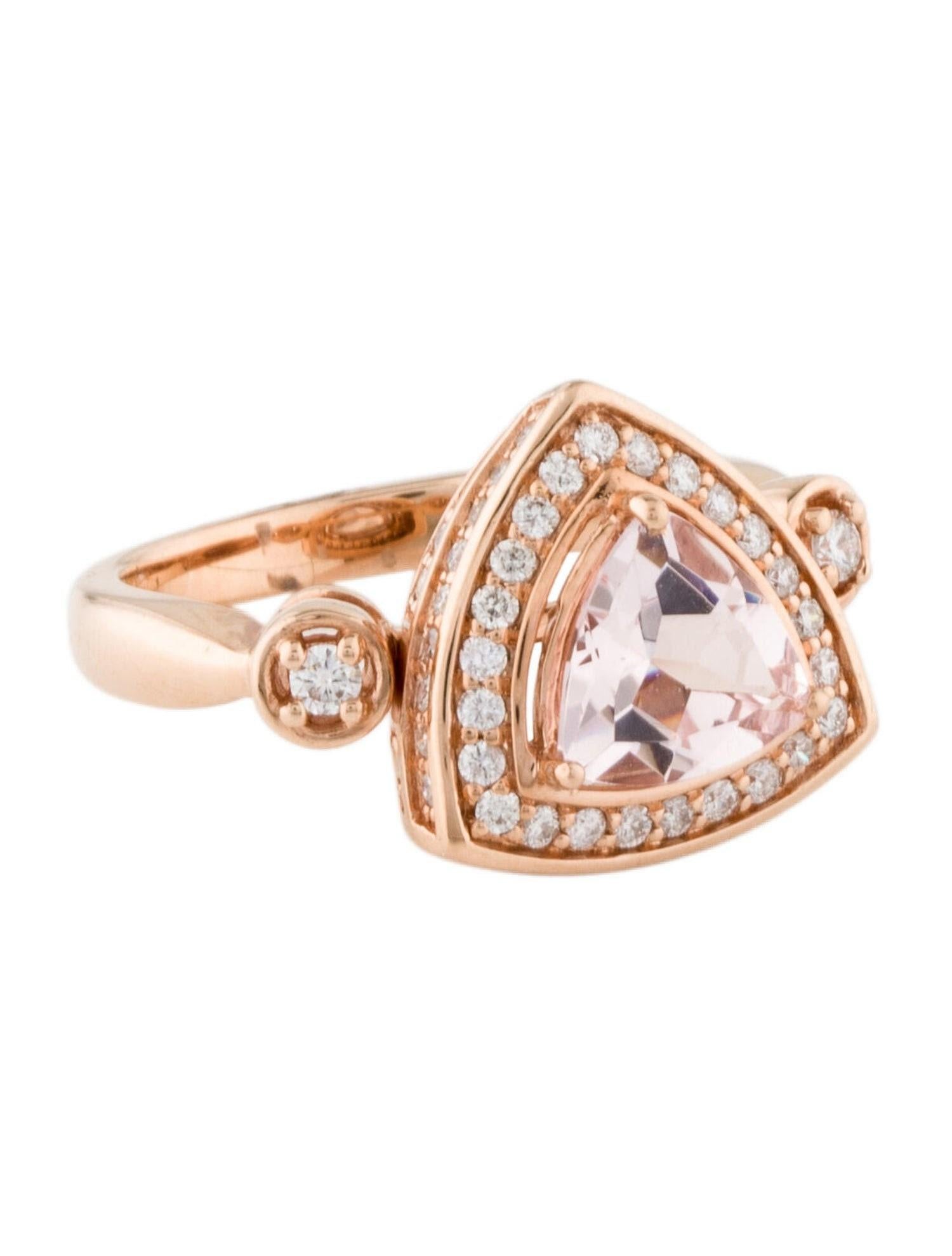 This is a gorgeous natural morganite and diamond halo vintage ring set in solid 14K rose gold. The natural trillion cut 1.29 carat morganite has an excellent peachy pink color and is surrounded by a halo of round-cut white diamonds. The ring is