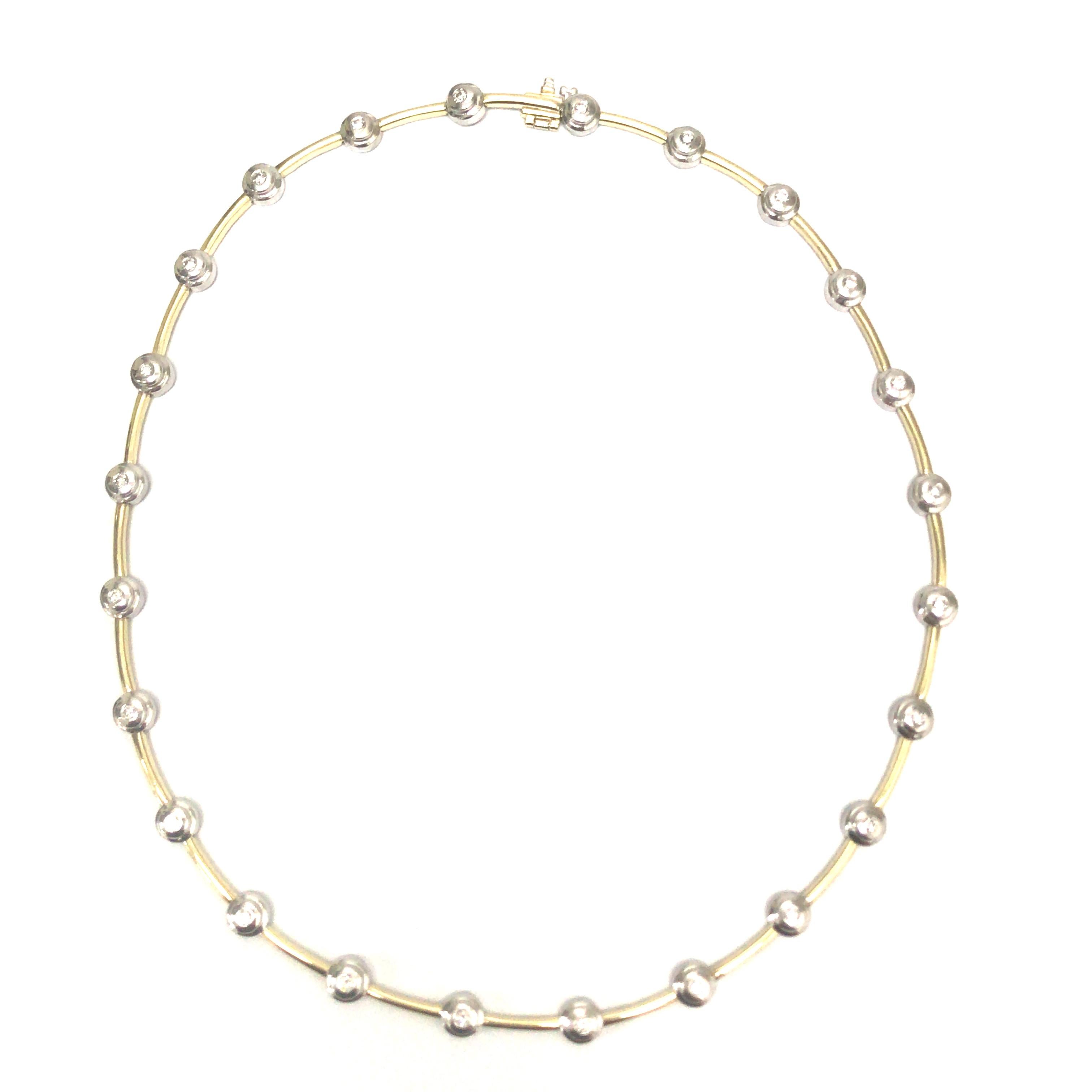 Diamond Bezel Link Necklace in 14K Two-Tone Gold.  (23) Round Brilliant Cut Diamonds weighing 1.28 carat total weight, G-I in color and VS-SI in clarity are expertly Bezel set alternating with Gold links.  The Necklace measures 16 inch in length and