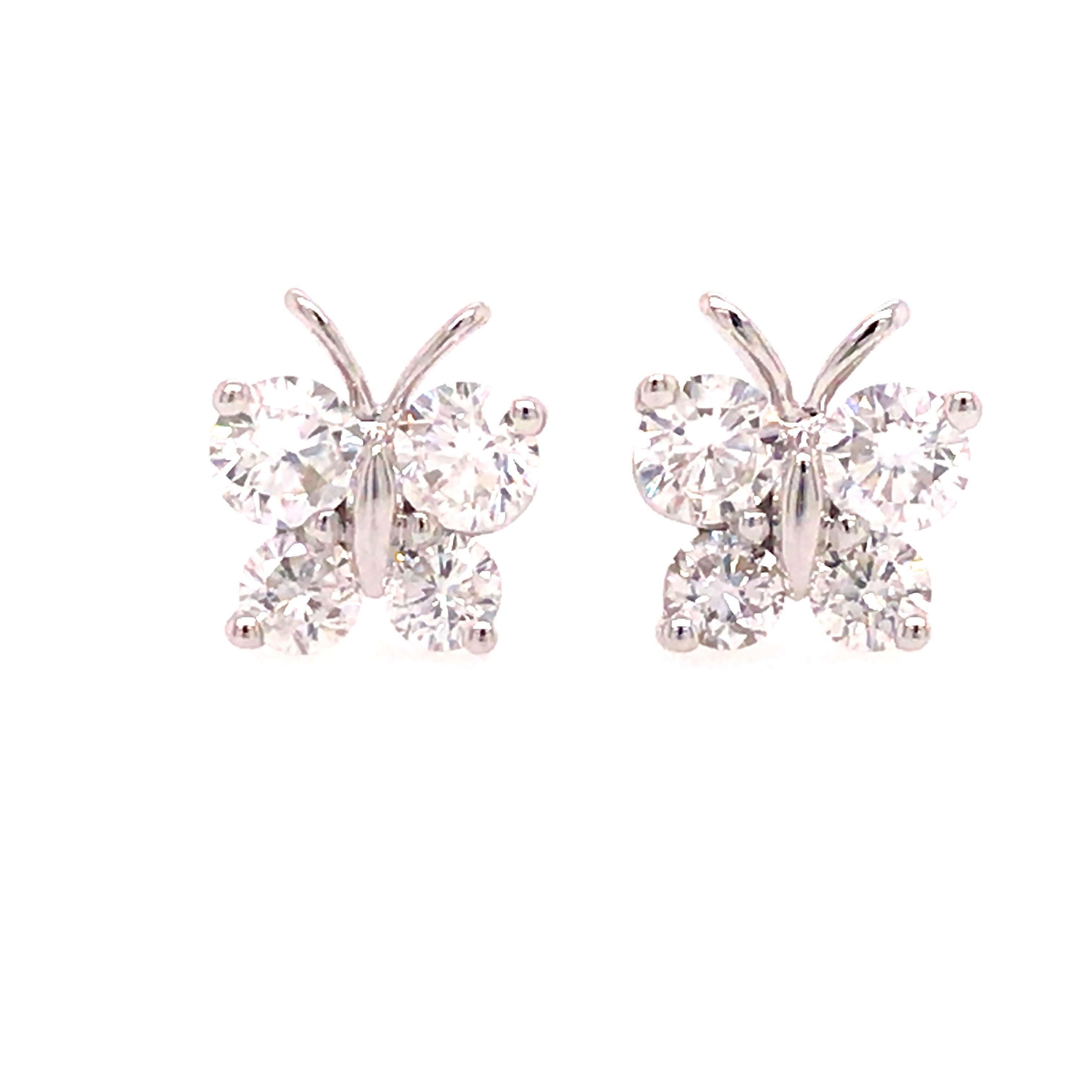 Diamond Butterfly Earrings in 14K White Gold.  (8) Round Brilliant Cut Diamonds weighing 0.52 carat total weight, G-H in color and VS in clarity are expertly set.  The Earrings measure 1/4 inch in length and width. 1.86 grams.