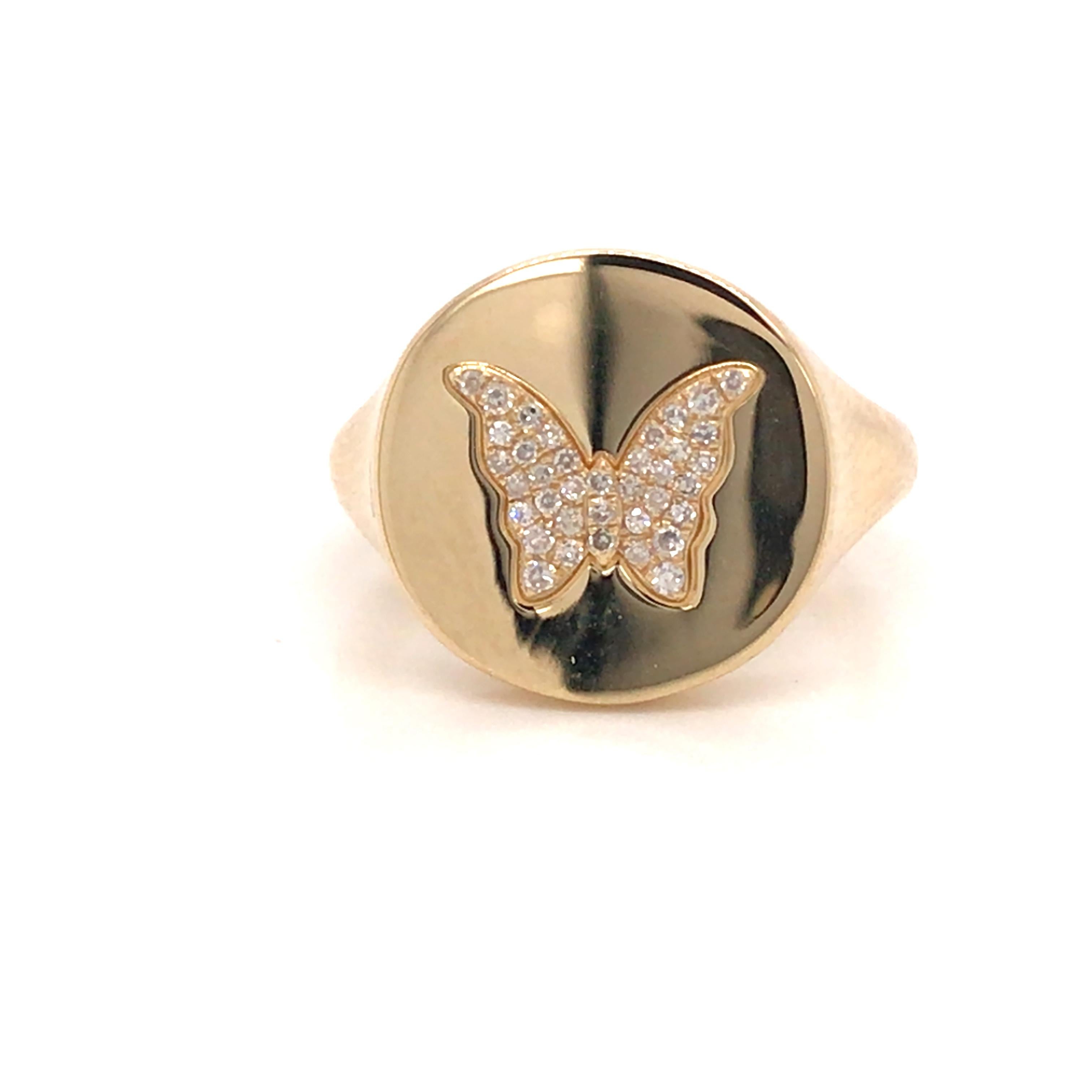 Diamond Butterfly Signet Ring in 14K Yellow Gold.  (37) Round Brilliant Cut Diamonds weighing 0.07 carat total weight, G-H in color and VS-SI in clarity are expertly set.  The Ring measures 1/2 inch in diameter. Ring size 4.  3.14 grams.