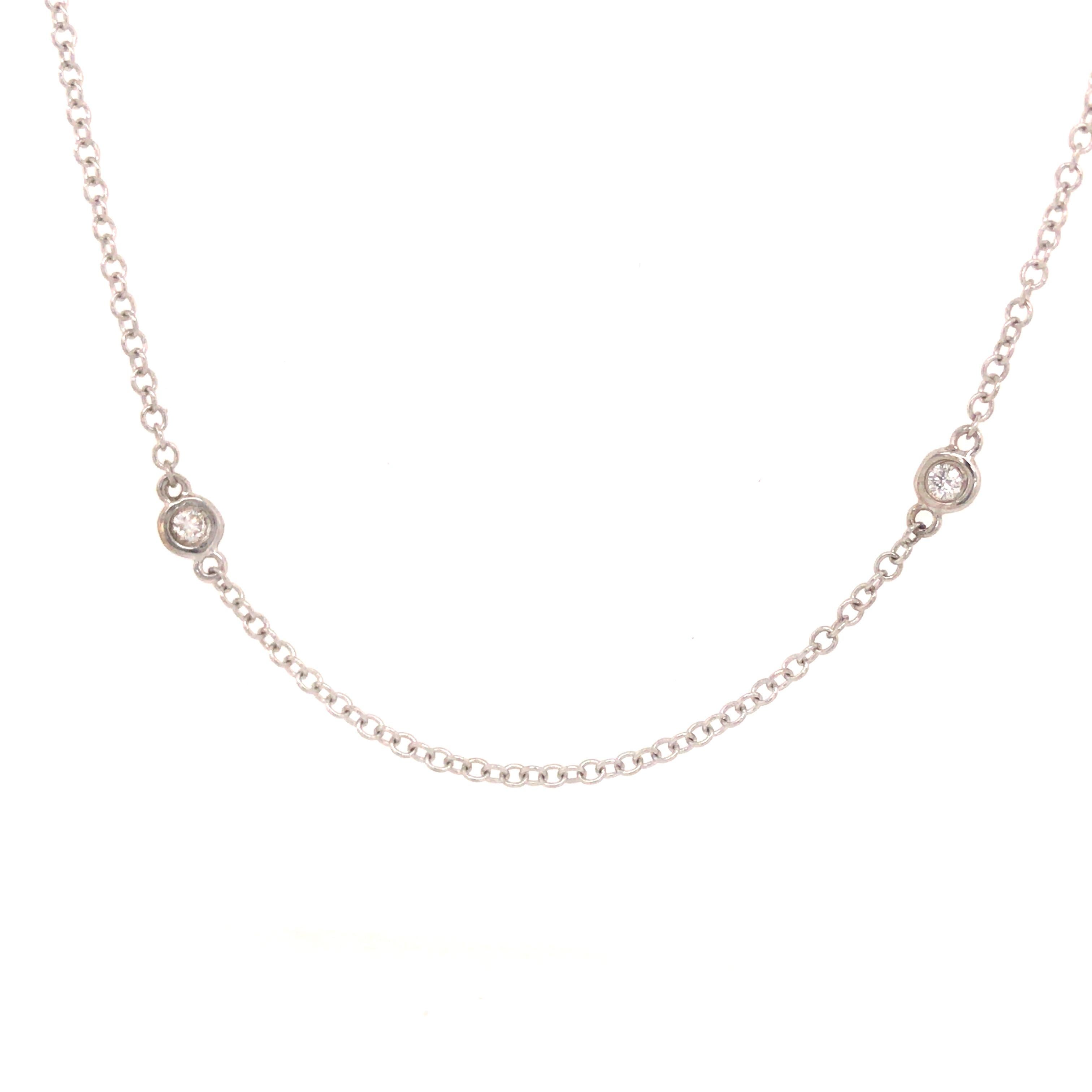 A classic Diamond-by-the-Yard Necklace in 14K White Gold.  Bezel set with Round Brilliant Cut Diamonds weighing 0.18 carat total weight, G-H in color and SI in clarity.  The necklace is 16 inches in length and weighs 1.71 grams.