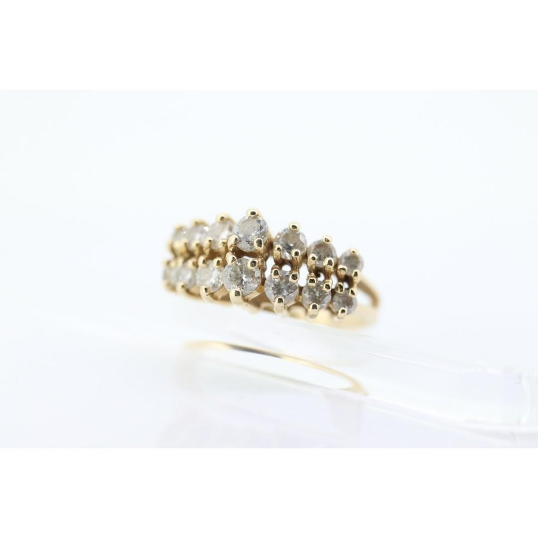 14k Diamond Cluster ring. Graduated 1ctw diamonds in 2 rows prong set band. For Sale 2