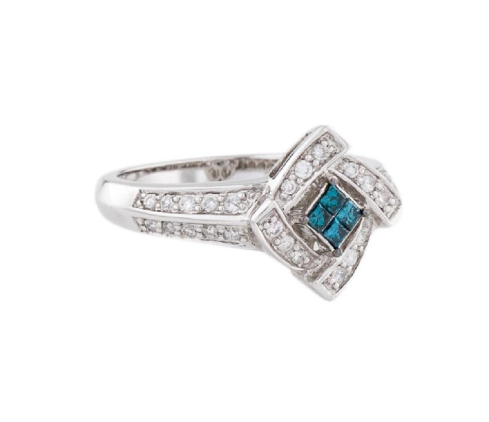 This is a cocktail diamond ring stamped in solid 14K white gold with blue gemstones. The mesmerizing round brilliant diamonds have an excellent look and is set on top of a timeless 14K white gold band.

*****
Details:
►Metal: White Gold
►Gold
