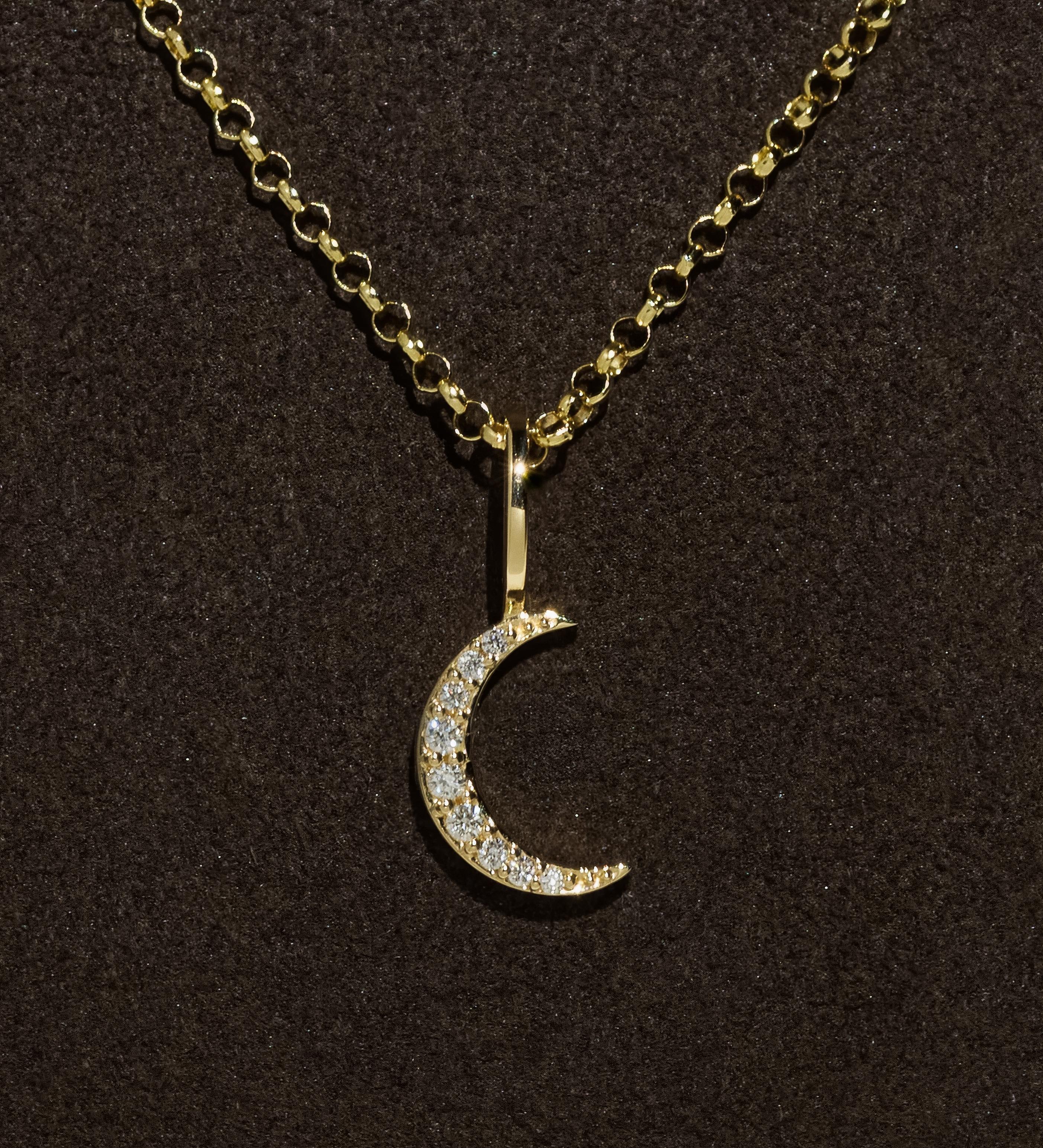 Exquisitely constructed from solid 14k yellow gold, this timeless rolo chain is elevated by our signature hand-pavé double-sided natural diamond clasp and crescent moon natural diamond pendant—a true statement of dreamy elegance. Designed to