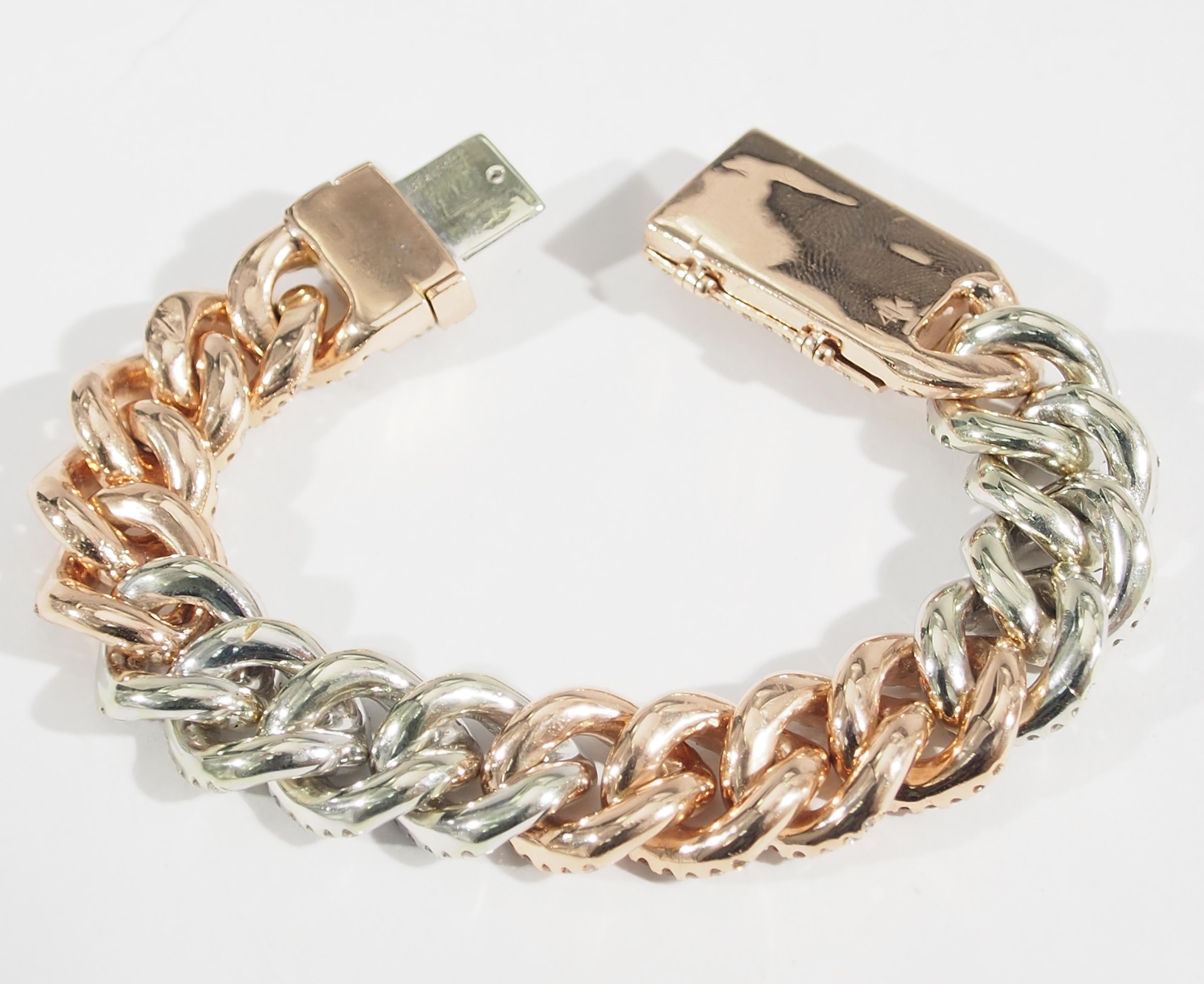 This is a Stunning 14K White and Rose Gold Solid Link Bracelet. Set with 639 Round Brilliant Cut Diamonds, G-I in Color, SI-I1 in Clarity approximately 12 total weight. The bracelet weighs 74.18 grams and secured with a Tongue Clasp. 7 1/2