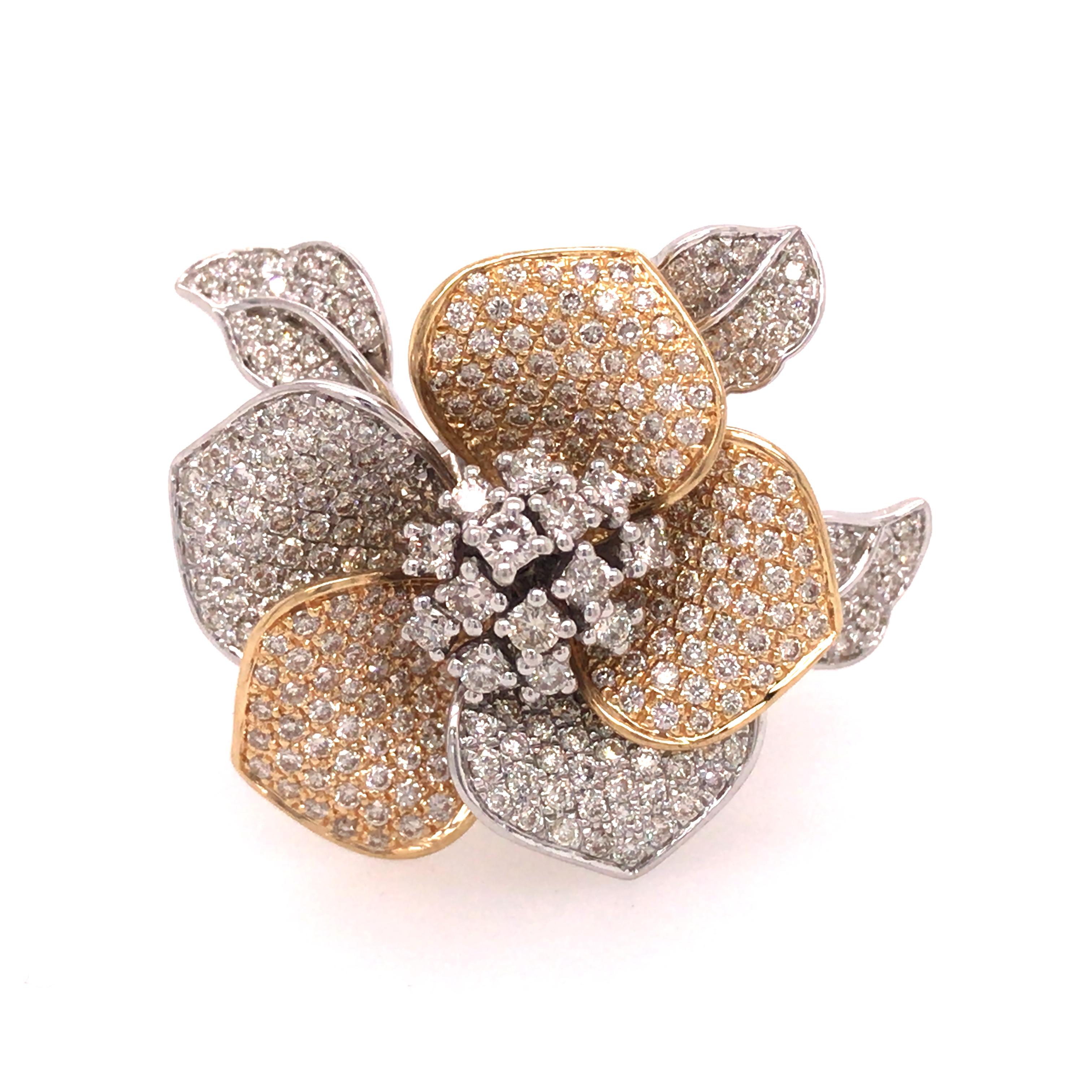 Diamond Flower Ring in 14K Two-Tone Gold.  Round Brilliant Cut Diamonds weighing 1.85 carat total weight, G-J in color and VS-SI in clarity are expertly set.  The petals of the flower are designed to gently move.  The Flower measures 1 inch in