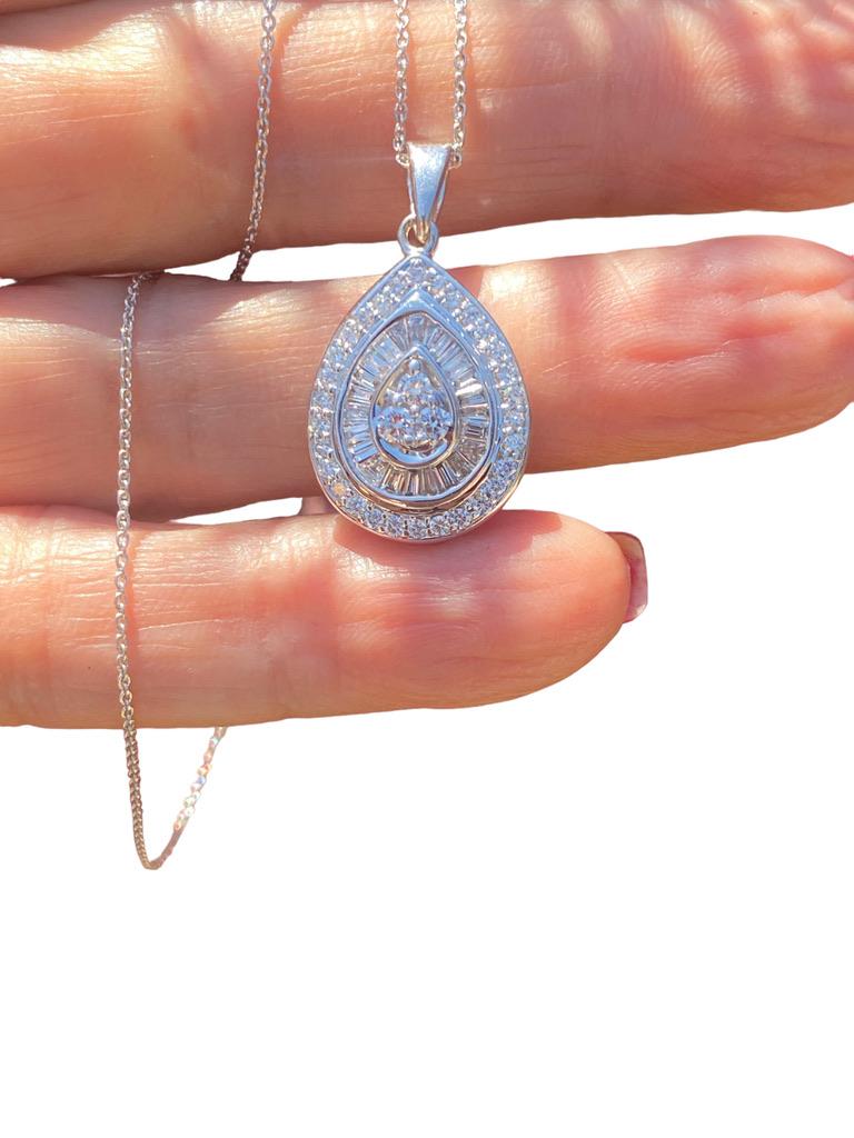 Impressive, Pear shaped diamond pendant of three halos is measured as 16.5 x 20 mm—the total pendant measures 1.50 