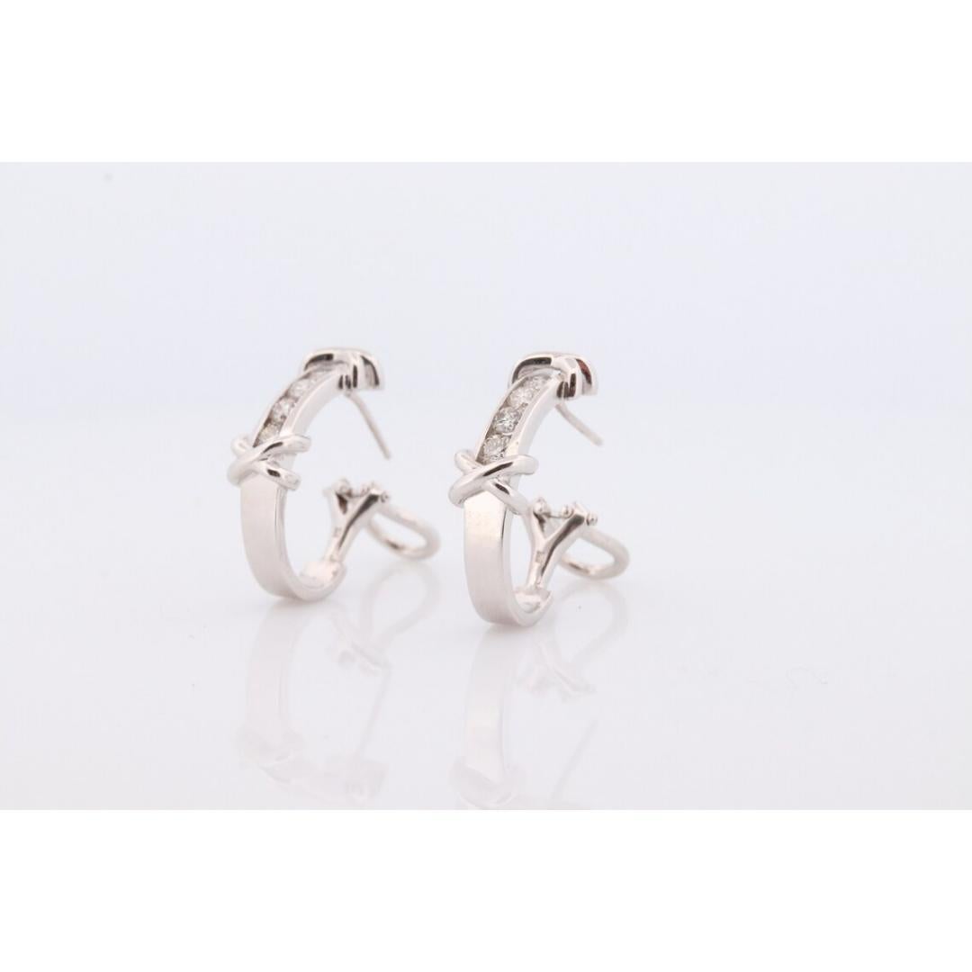 Vintage from the 1970s
Materials: Gold
Gemstone: Diamond

Location: Earlobe


Magnificent Hoop earrings. 14k White Gold Hoops with channel set diamonds.

Appraised at $1650 Replacement Value. Appraisal is included.

XOXO Design

Condition: Shows no