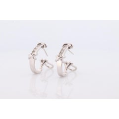 14k Diamond Hoop Earrings. Diamond Channel set diamond XOXO Earrings. Est 0.65ct