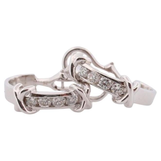 14k Diamond Hoop Earrings. Diamond Channel set diamond XOXO Earrings. Est 0.65ct For Sale