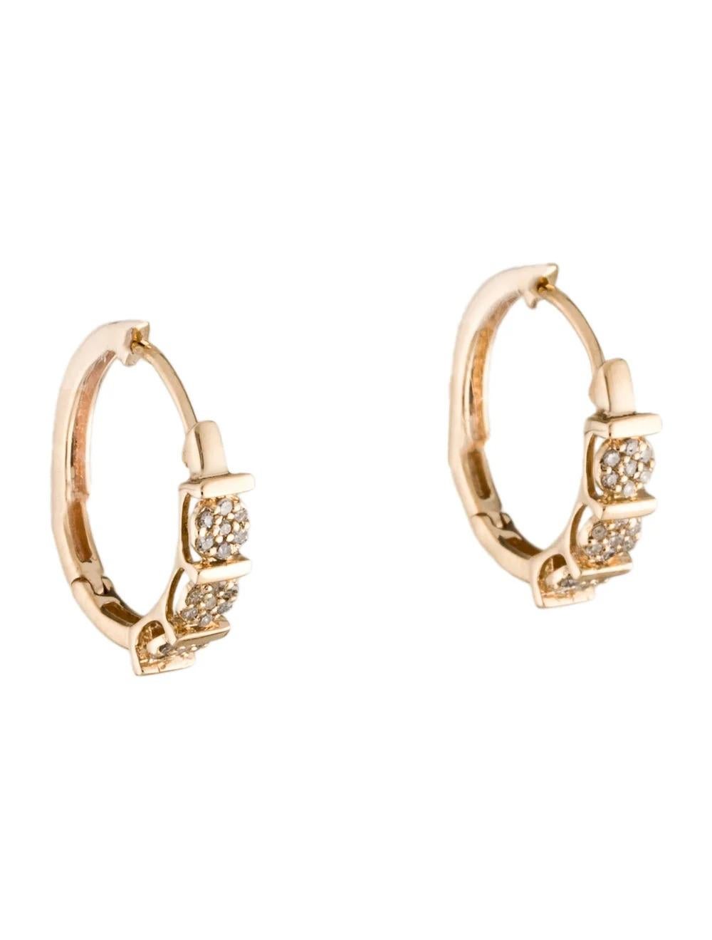 Enhance your elegance with these stunning 14K yellow gold diamond hoop earrings, a timeless accessory for any occasion.

Specifications:

* Metal Type: 14K Yellow Gold
* Length: 0.75 inches
* Width: 0.25 inches
* Total Item Weight: 2.9 grams
*