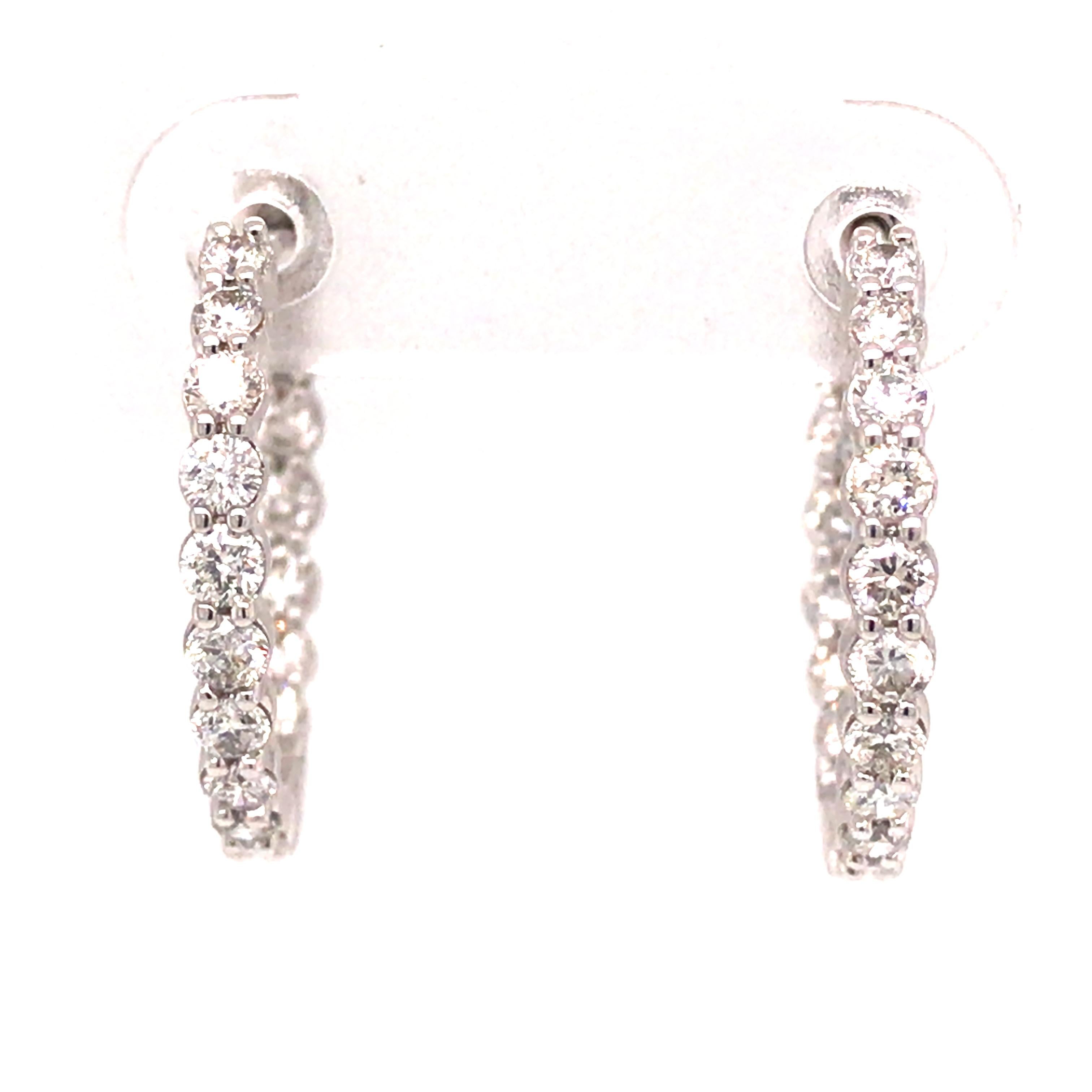 Diamond In/Out Hoop Earrings in 14K White Gold.  Round Brilliant Cut Diamonds weighing 1.00 carat total weight, G-H in color and VS in clarity are expertly set.  The Earrings measure 3/4inch in diameter.  2.95 grams.