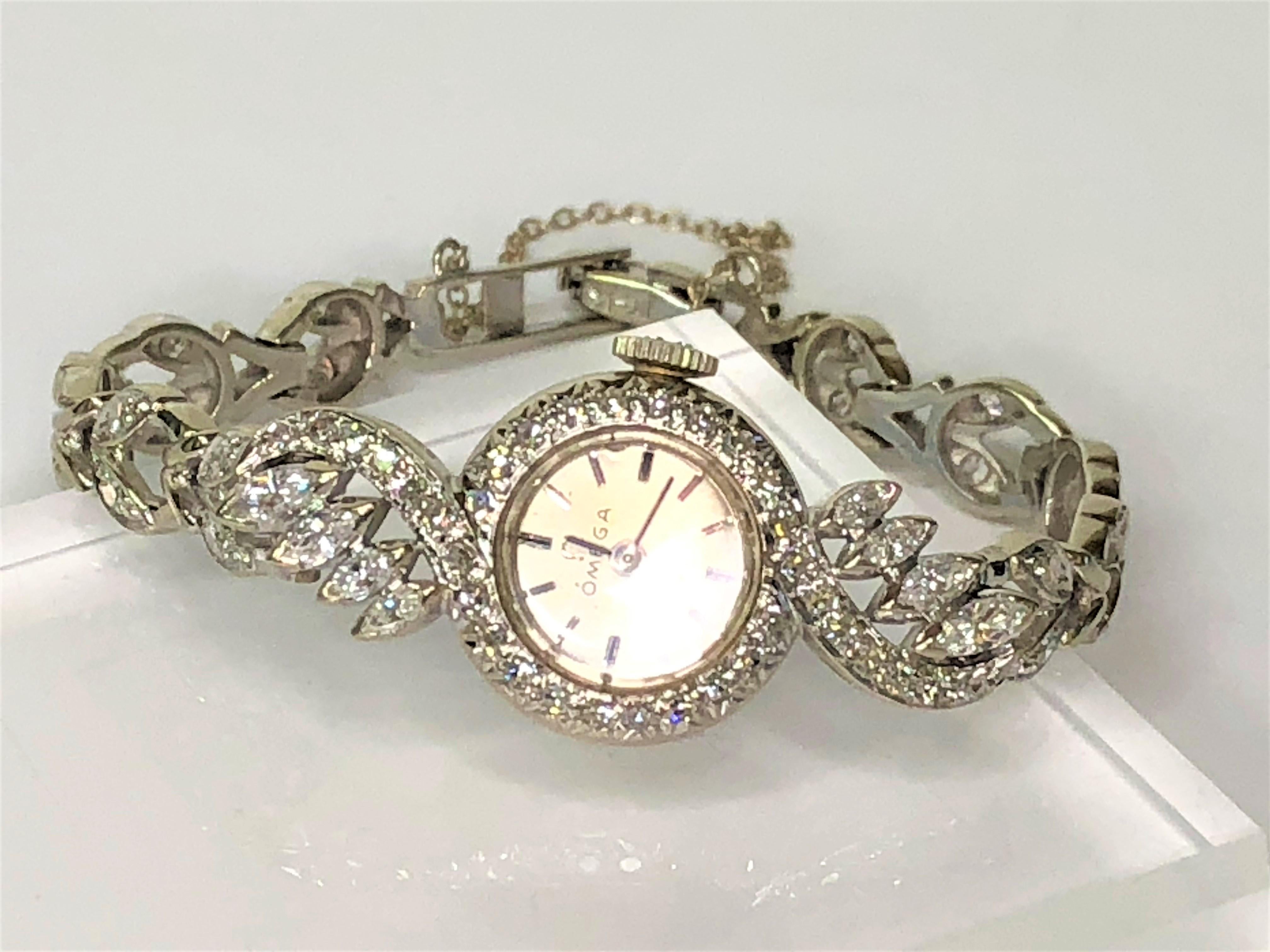 This intricate Omega watch sparkles from across the room.  Beautiful, unique design makes this watch a must have!
14 karat white gold
Approximately 1.20 total diamond weight
34 round single cut diamonds, approximately .34tdw, and 8 marquise