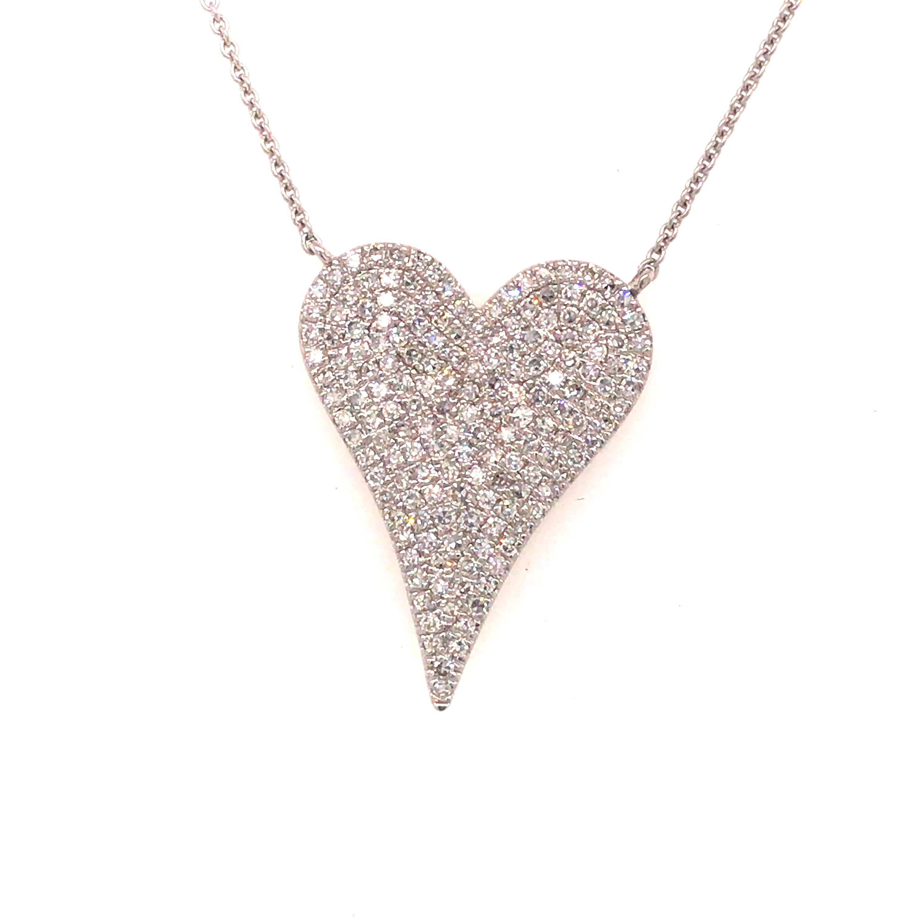 Diamond Pave Heart Necklace in 14K White Gold.  Round Brilliant Cut Diamonds weighing 0.53 carat total weight, G-I in color and VS in clarity are expertly set.  The Necklace measures 17 inch in length.  The Pendant measures 7/8 inch in length and
