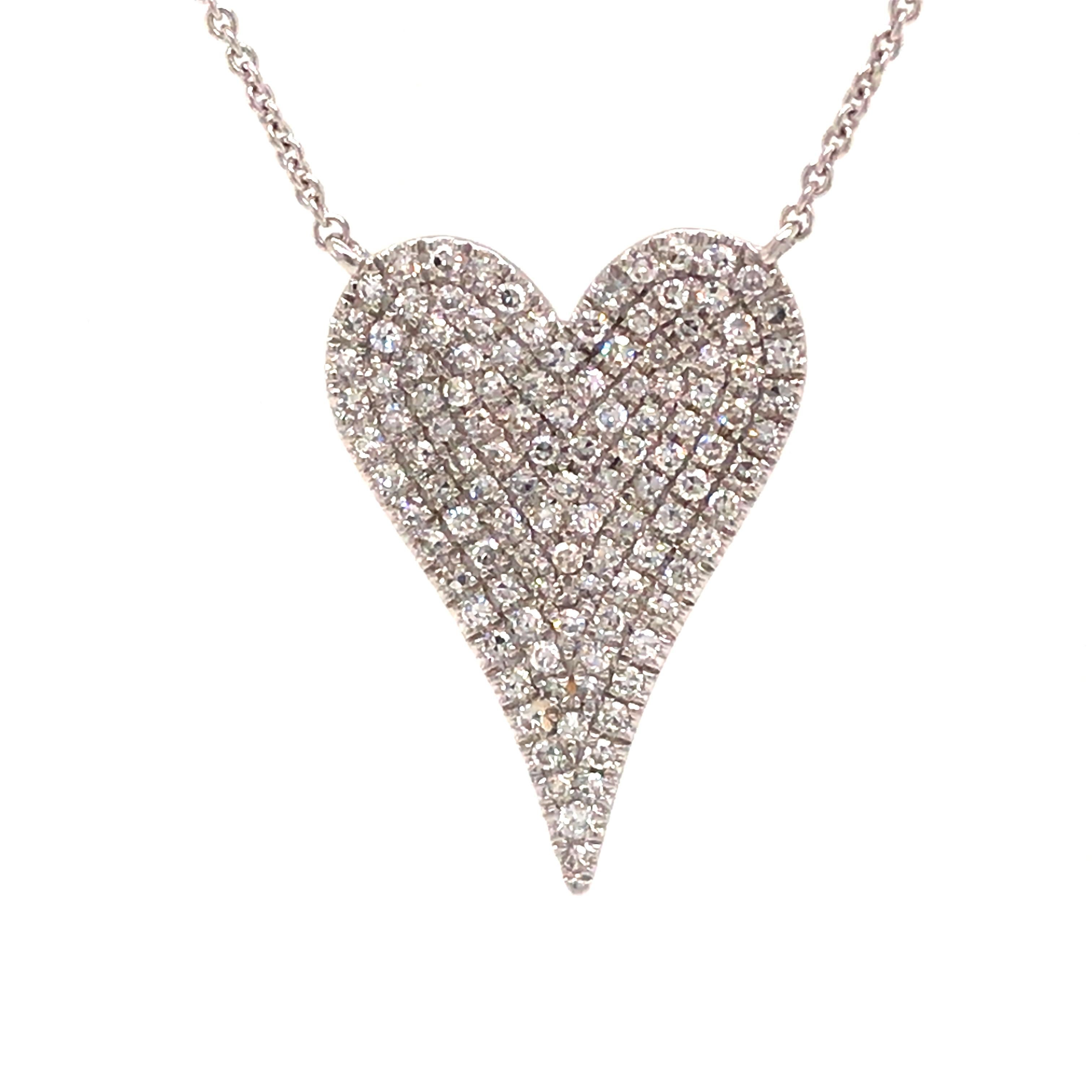 Diamond Pave Heart Necklace in 14K White Gold.  Round Brilliant Cut Diamonds weighing 0.38 carat total weight, G-H in color and VS-SI in clarity are expertly set.  The Necklace measures 17 inch in length and the Pendant measures 3/4 inch in length