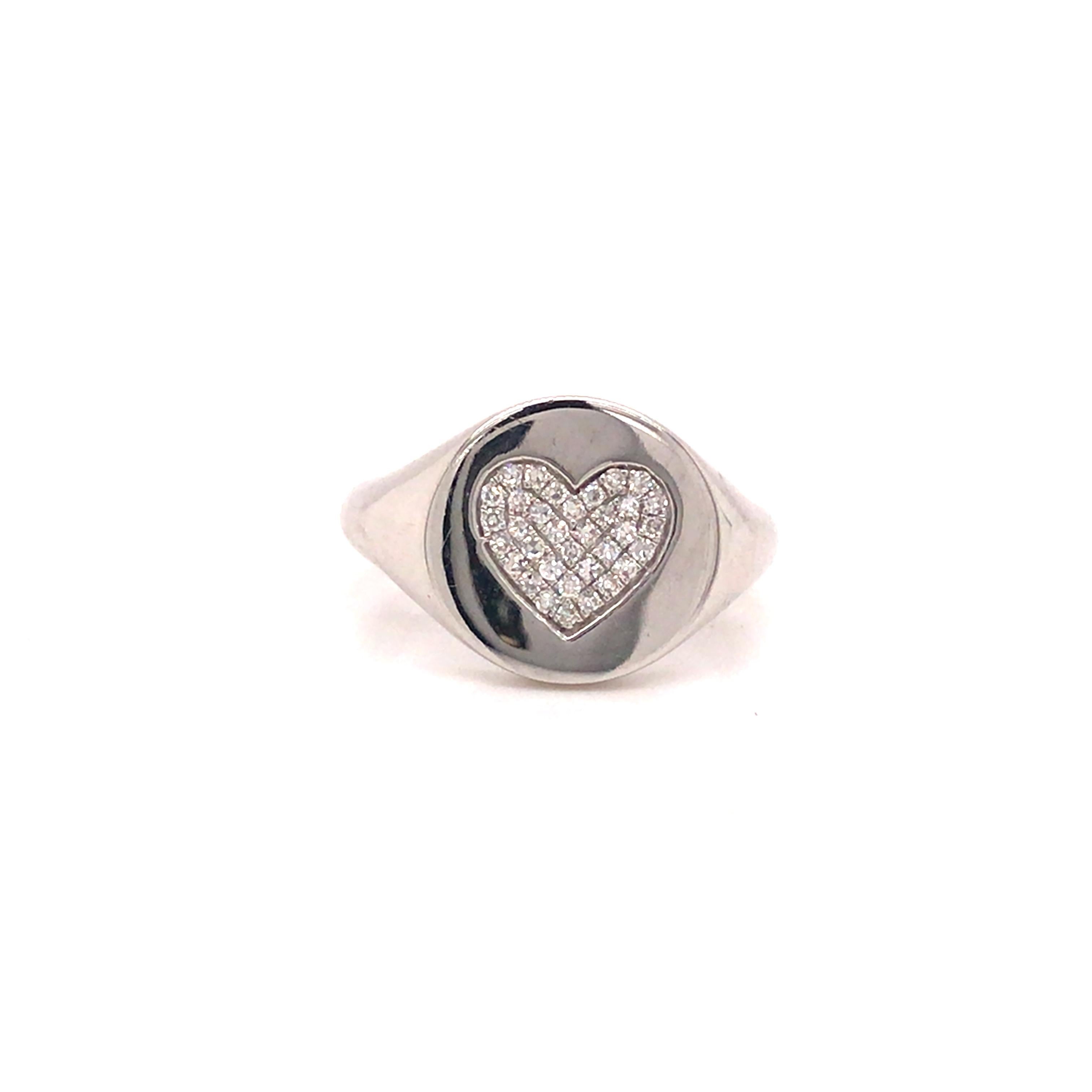 Diamond Pave Heart Signet Pinky Ring in 14K White Gold.  (34) Round Brilliant Cut Diamonds weighing 0.11 carat total weight, G-H in color and VS-SI in clarity are expertly set.  The Ring Top measures 1/2 inch in diameter. Ring size 3 3/4. 3.26 grams.