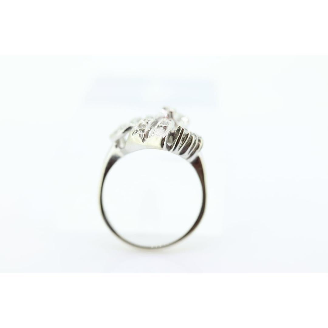 Vintage from the 1960s
Size: 6 1/2 US
Materials: Platinum
Gemstone: Diamond
Gem color: Colorless
Band color: Silver
Adjustable

Style: Edwardian

Beautiful Diamond Ring.

Wonderful Leaf Knot design.
14k White Gold.

Condition: Shows no visible