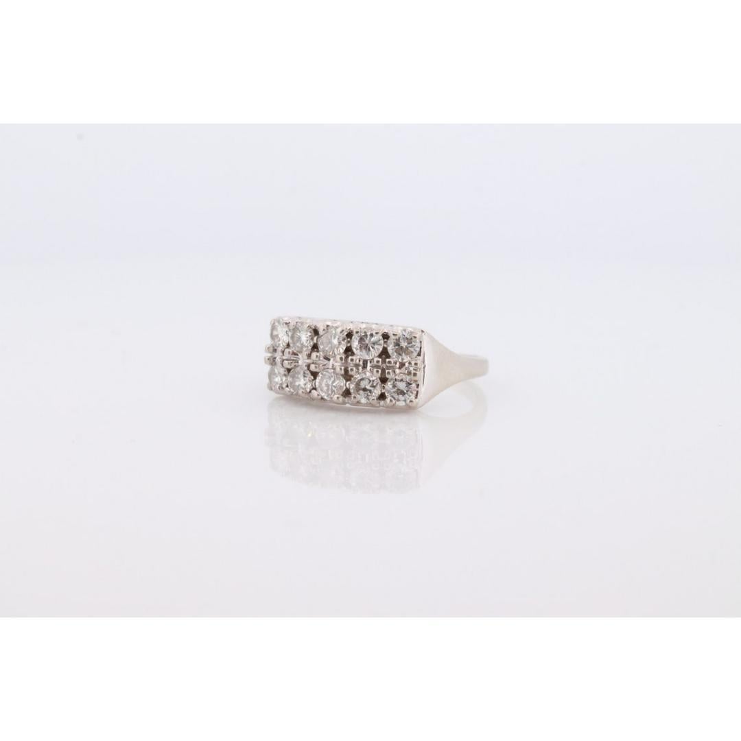 Vintage from the 1990s
Size: 8 US
Materials: Stone
Gemstone: Diamond
Gem color: Colorless
Band color: White

Style: Mid-century

Beautiful 14k White Gold 2row Diamond Cluster ring.
Full 0.75ctw total Diamonds

Appraised at $1850 Replacement value.