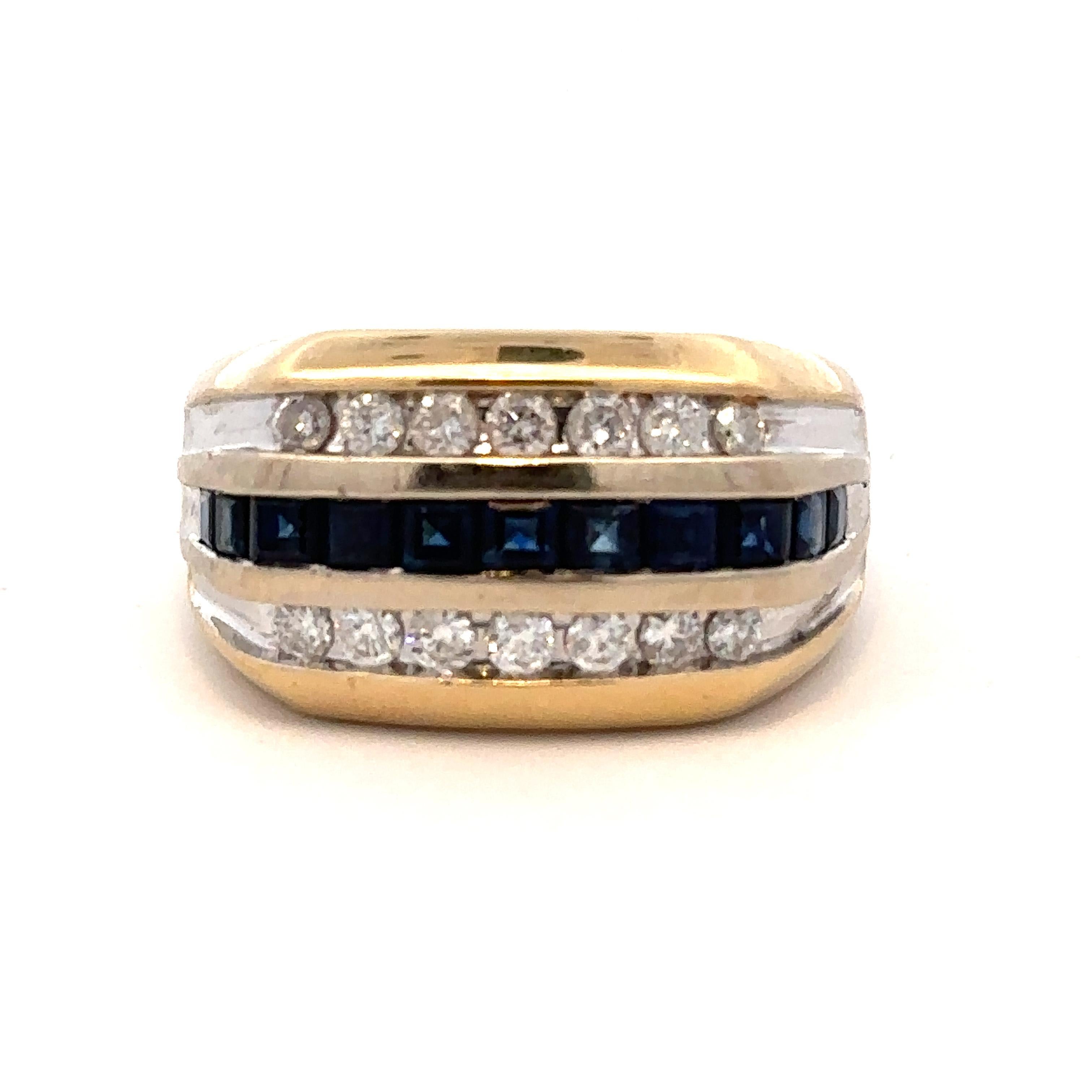 A striking modern setting of sapphires and diamonds in a 14k bi-colored yellow and white gold ring, size 10.5 (sizeable). The diamonds weigh approximately 0.8 ctw, and the sapphires approximately 1.05 cts total (all stones measured in setting). 