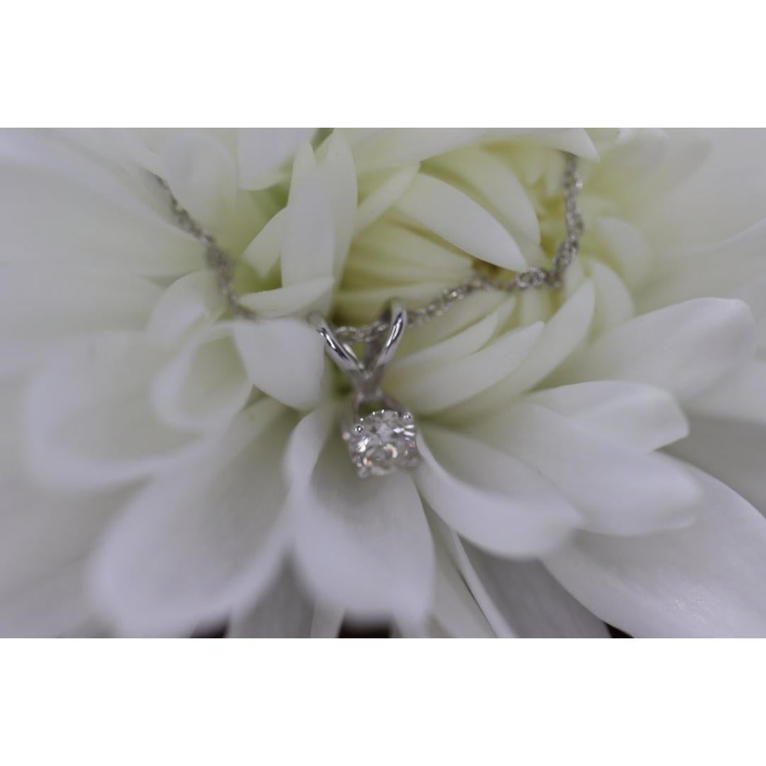 Vintage
Materials: Stone
Gemstone: Diamond

Style: Minimalist

Wonderful dainty solitaire diamond pendant necklace.

Condition: Shows no visible signs of wear.

3mm diamond 0.10ct color F SI2 (tiny internal crack in the middle)
1mm 14k white gold