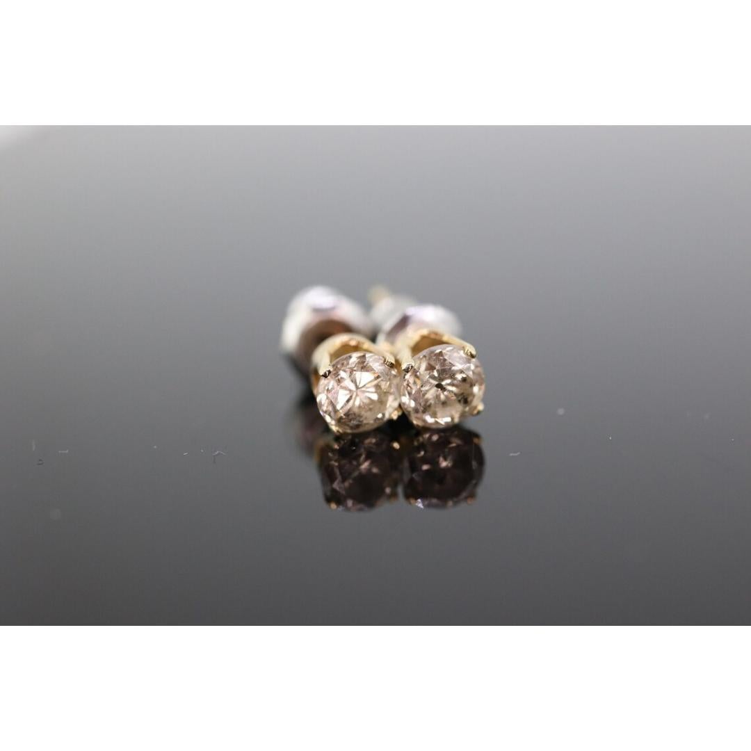 Vintage
Materials: Gold
Gemstone: Diamond
Location: Earlobe
Closure: Push back

Style: Minimalist

14k Yellow gold

4mm round diamonds. 0.25ct each.
0.50ctw est K color I2 clarity
0.6grams