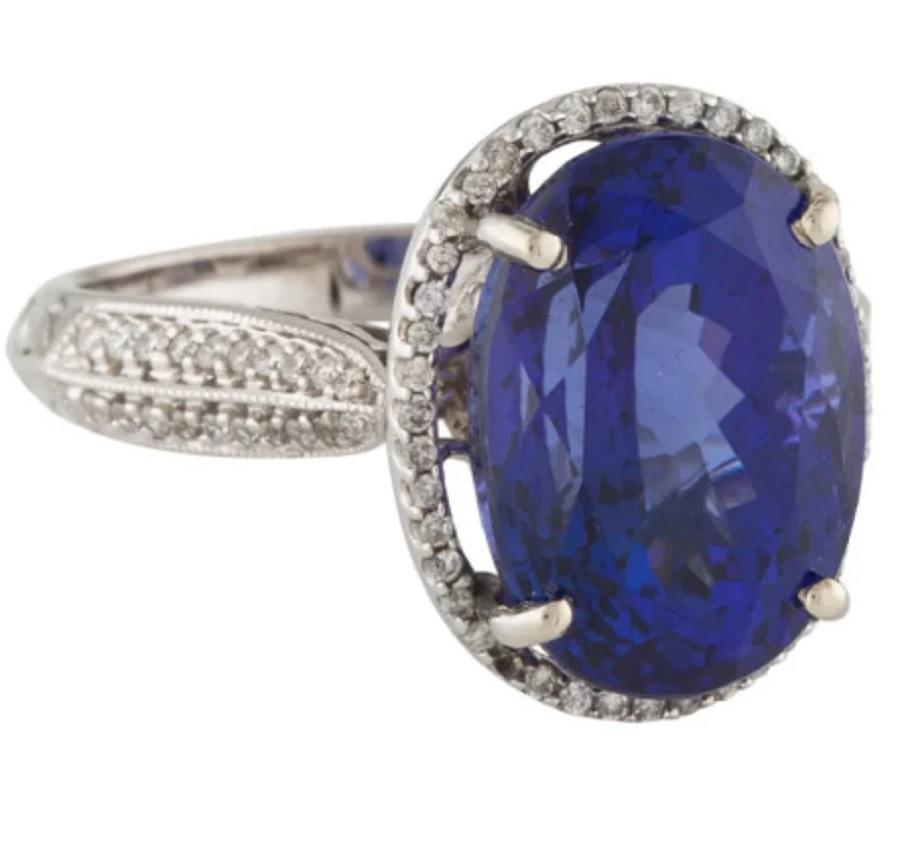 This is a gorgeous diamond tanzanite ring stamped in solid 14K white gold. The mesmerizing  round brilliant diamonds have an excellent look and is set on top of a timeless 14K white gold band.

*****
Details:
►Metal: White Gold
►Gold Purity: