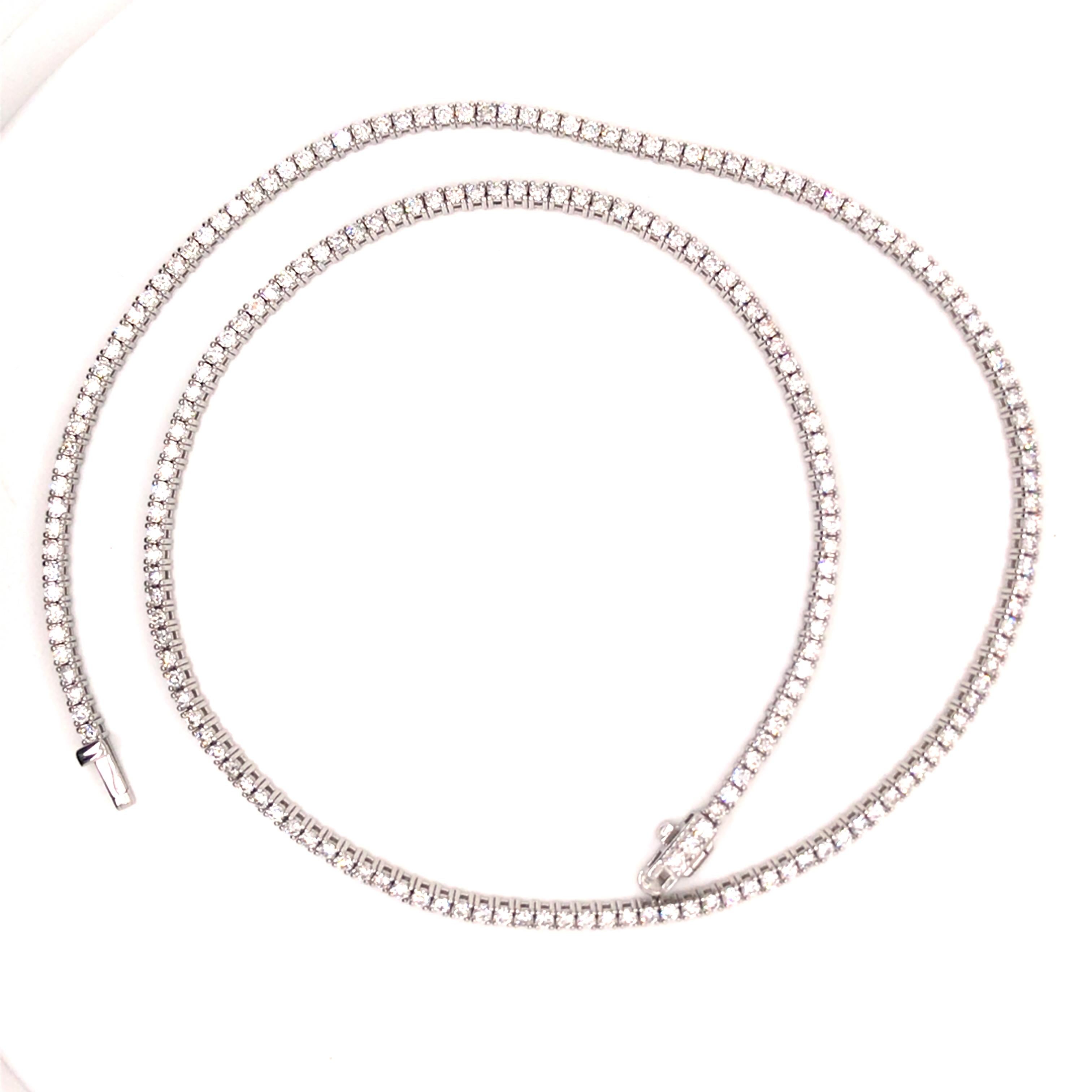 Diamond Tennis Necklace in 14K White Gold.  Round Brilliant Cut Diamonds weighing 4.59 carat total weight, G-I in color and SI in clarity are expertly set.  The Necklace measures 17 1/4 inch in length.  15.9 grams.