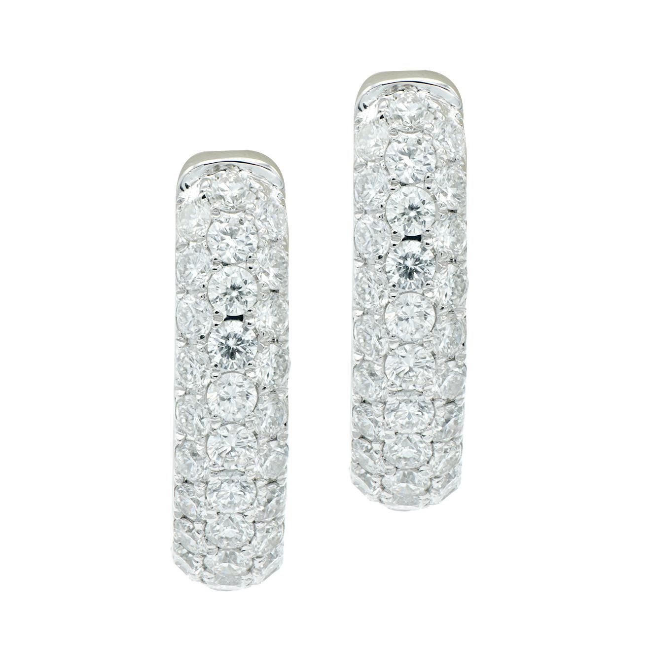 These beautiful huggie style earrings shimmer and sparkle with 3 rows of 122 SI, H color diamonds that total 3.05 carats that are on the outside of the earring and the inside of the back for shine at every angle. They are set in 6.0 grams of 14