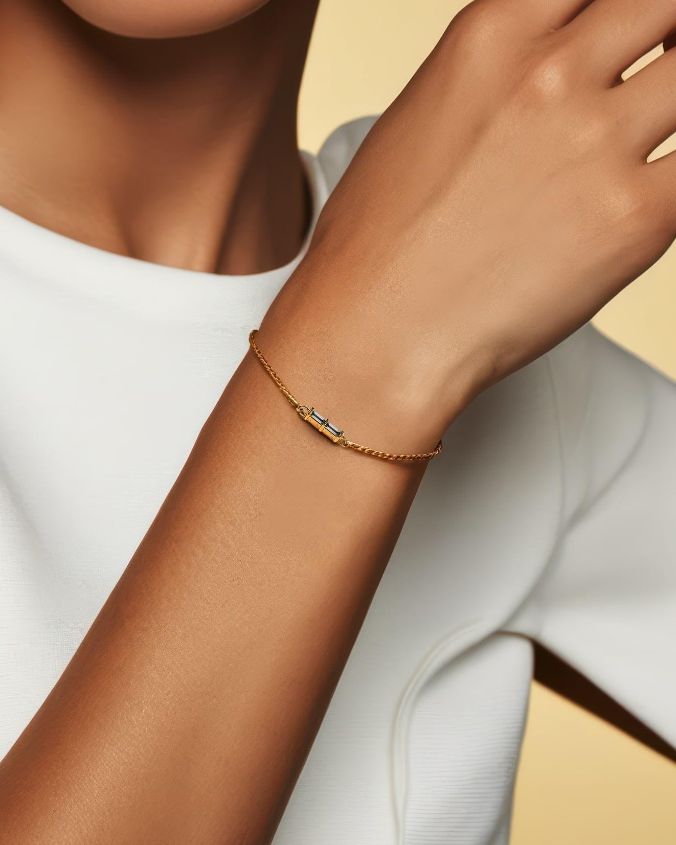 Modern and sophisticated, this Baguette Diamond 14K Gold Chain Bracelet features two stunning baguette-cut diamonds, set side by side to create a sleek and elegant look. Crafted in luxurious 14K gold, the bracelet’s minimalist design allows the