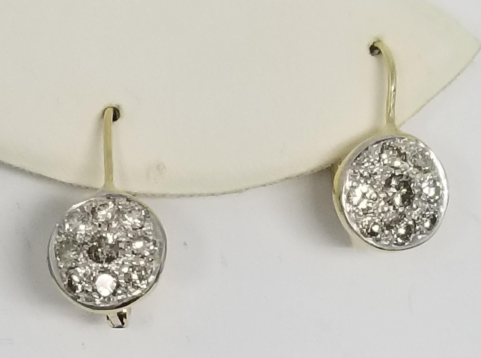 14k drop diamond cluster earrings, containing 18 round full cut diamonds weighing .95pts. with a euro back earring. the quality of the diamonds are; color I-J, clarity VS