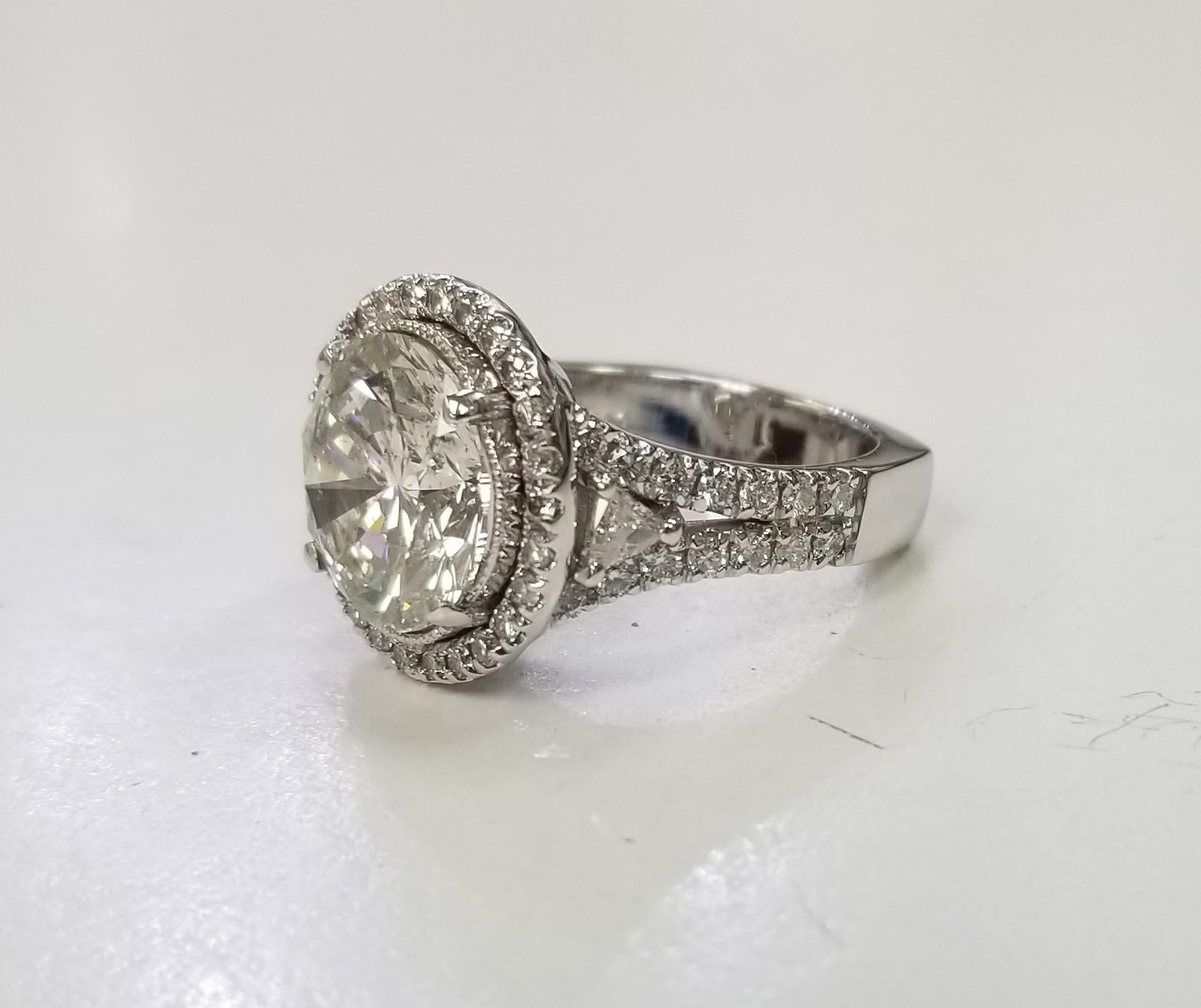 *Motivated to Sell – Please make a Fair Offer*
                       Beautiful Flash

Number of Diamonds:	57	
Main Stone Shape:	Round 5.24 carats
Diamond Color Grade:	H
Main Stone Width:	11.38 x 11.27 x 6.68MM
Diamond Clarity Grade:	SI2
Secondary