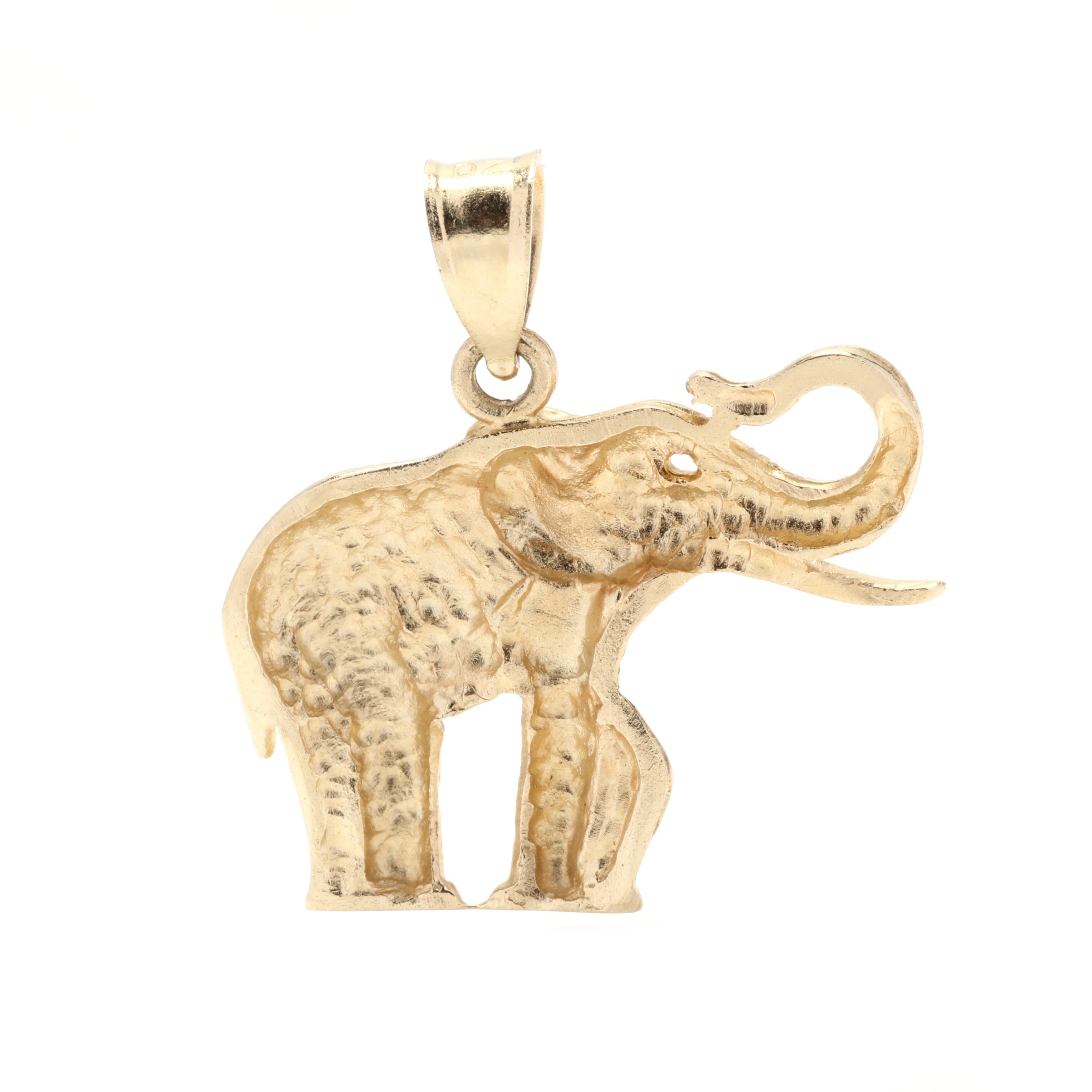 A vintage 14 karat yellow gold elephant charm. This charm features an elephant motif suspended from a tapered bail.



Length: 15/16 in.



Width: 7/8 in.



Weight: 1.8 dwts.