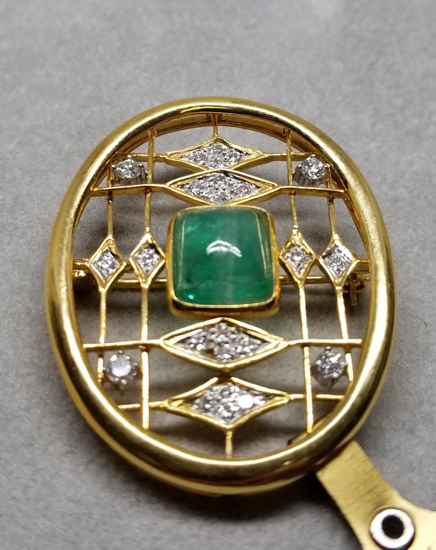 This piece of fine jewelry was designed and hand crafted by “Moshi” of New York, it was found in a vault from an estate sale and was never used.  14k emerald and diamond pin containing 1 cushion cut cabochon emerald weighing 2.67cts. and 24 round