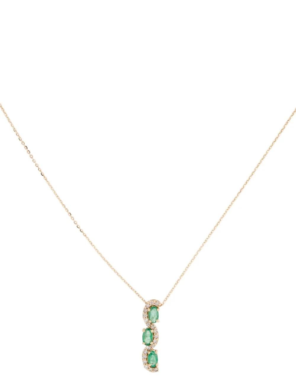 Indulge in luxury with our meticulously crafted 14K Yellow Gold Emerald & Diamond Pendant Necklace. This stunning necklace is adorned with a trio of mesmerizing gemstones, including a 0.423 Carat Oval Brilliant Emerald and 0.15 Carats of dazzling