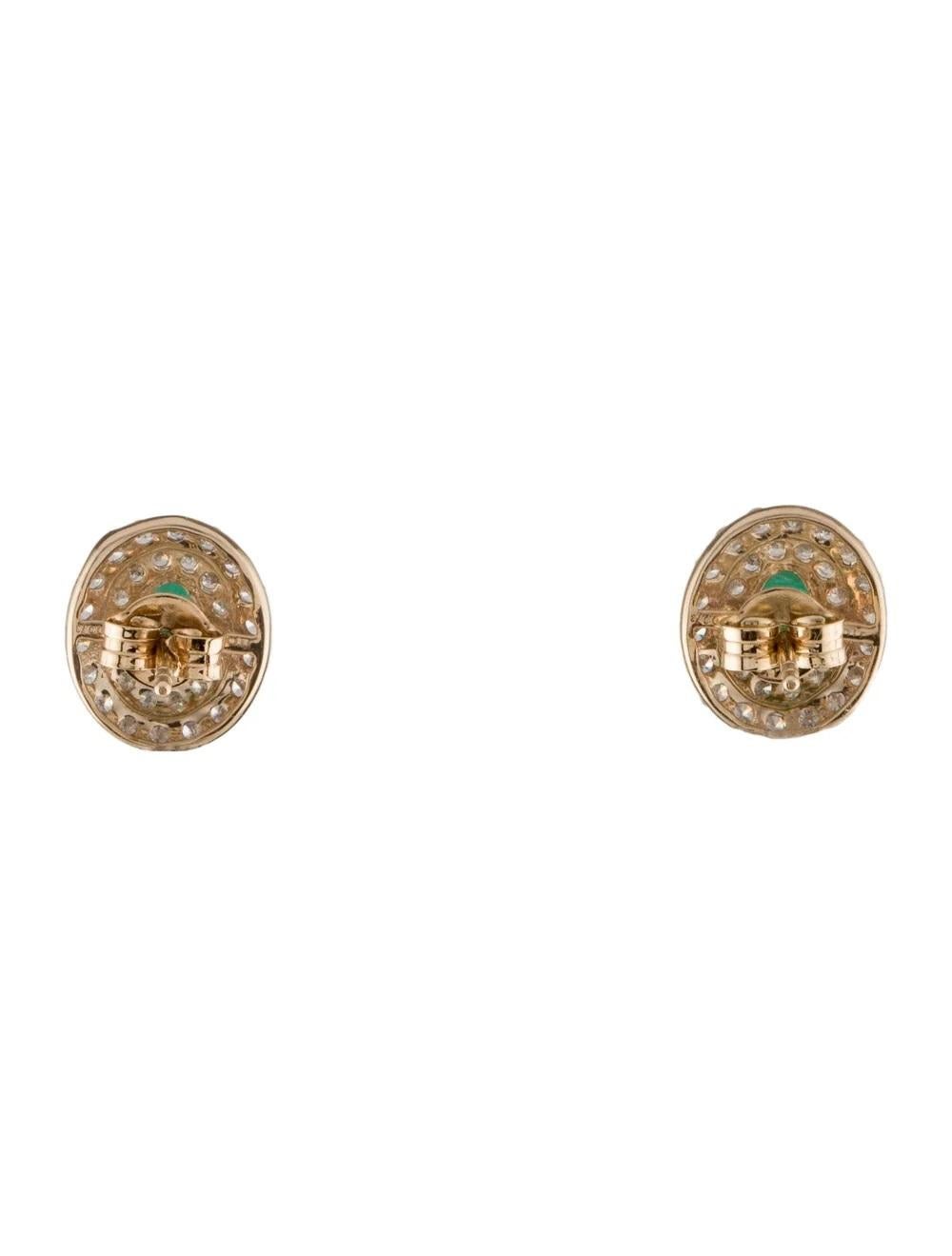 Oval Cut 14K Emerald & Diamond Stud Earrings  Timeless Elegance in Yellow Gold For Sale