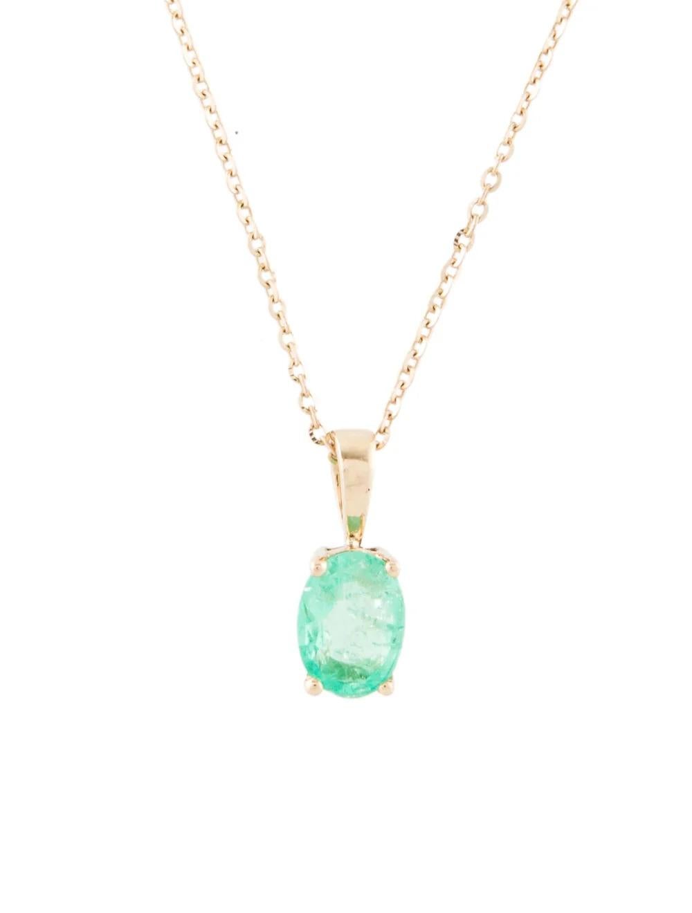 This captivating 14K Yellow Gold necklace is a stunning showcase of elegance and sophistication, featuring a remarkable 0.67 Carat Oval Modified Brilliant Emerald. Crafted with meticulous attention to detail, this exquisite piece exudes timeless