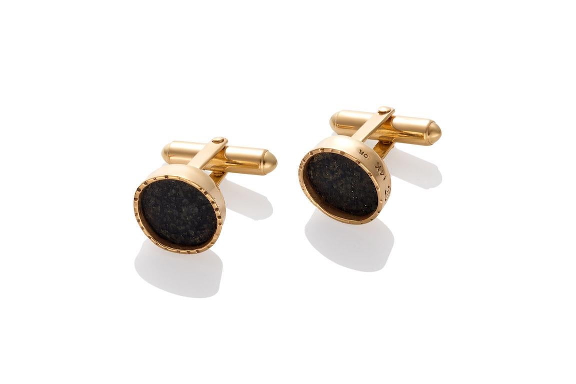 Emu *(reinforced) shell bezel set in 14K yellow gold are a handsome set.  The muted gray and dark blue colors of the Emu shell look striking against the warmth of the yellow gold textured settings.
The cufflink findings are solid 14K gold.