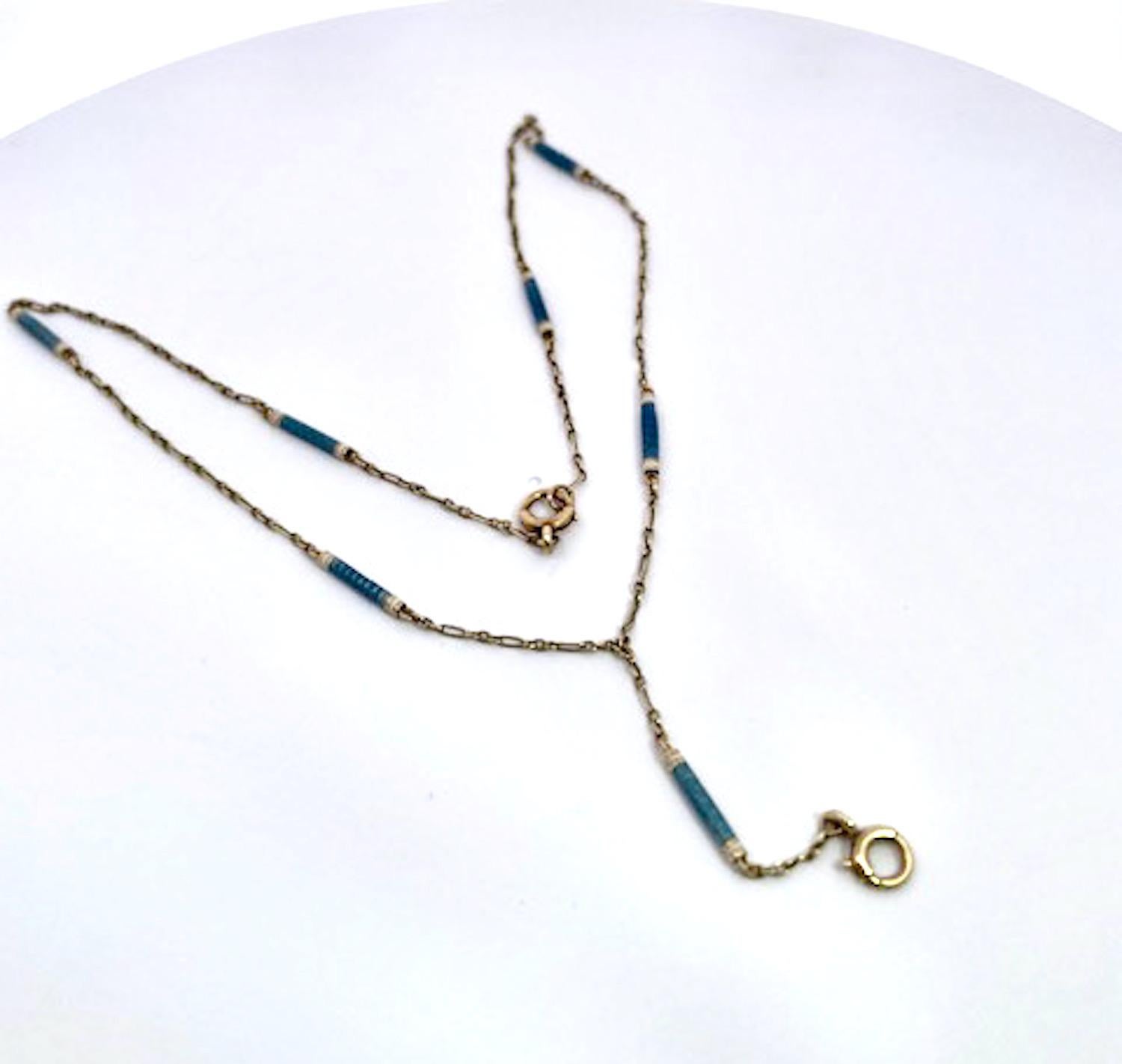 This lovely baton Chain is perfect to display a special piece on the end link.  This necklace is 14K Yellow Gold with enamel in a beautiful blue with a white stripe on the edges.  This chain is 14