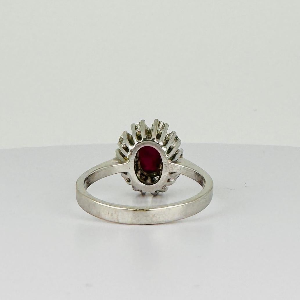 14k entourage white gold ring with oval ruby with 10 diamonds 0.50 carat VSI 2