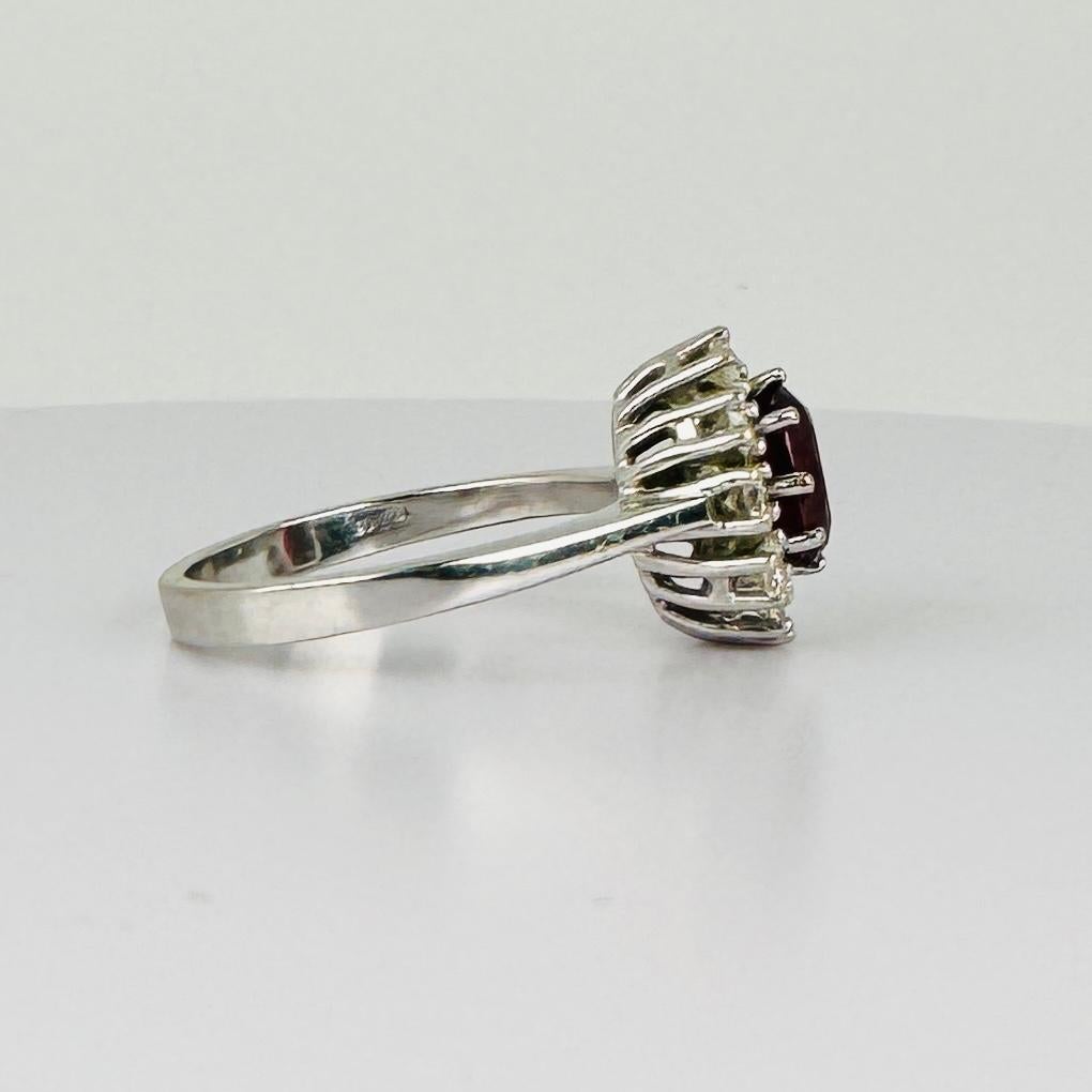 14k entourage white gold ring with oval ruby with 10 diamonds 0.50 carat VSI 3
