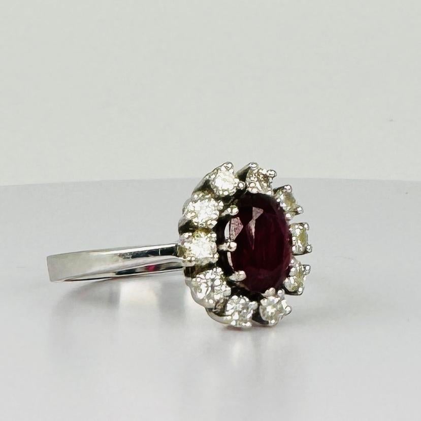 14k entourage white gold ring with oval ruby with 10 diamonds 0.50 carat VSI 4